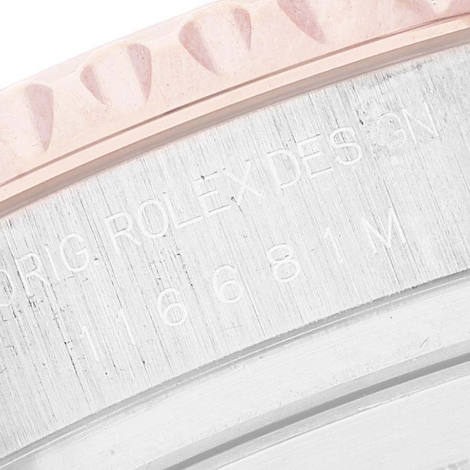 The image shows a close-up angle of the engraved inner bezel of the Yacht-Master watch by Rolex.