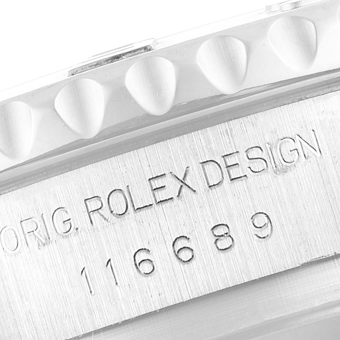 The image shows a close-up of the side engraving on a Rolex Yacht-Master 116689 Men's White Gold White Dial 116689 Men's White Gold White Dial watch, displaying the model number and “ORIG. ROLEX DESIGN.”