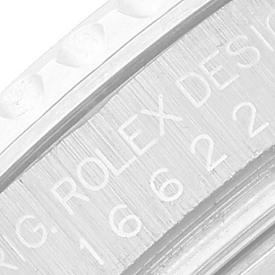 The image shows a close-up of the bezel and rehaut of the Rolex Yacht-Master 16622 Men's Stainless Steel Silver Dial 16622 Men's Stainless Steel Silver Dial watch displaying part of the branded engraving.