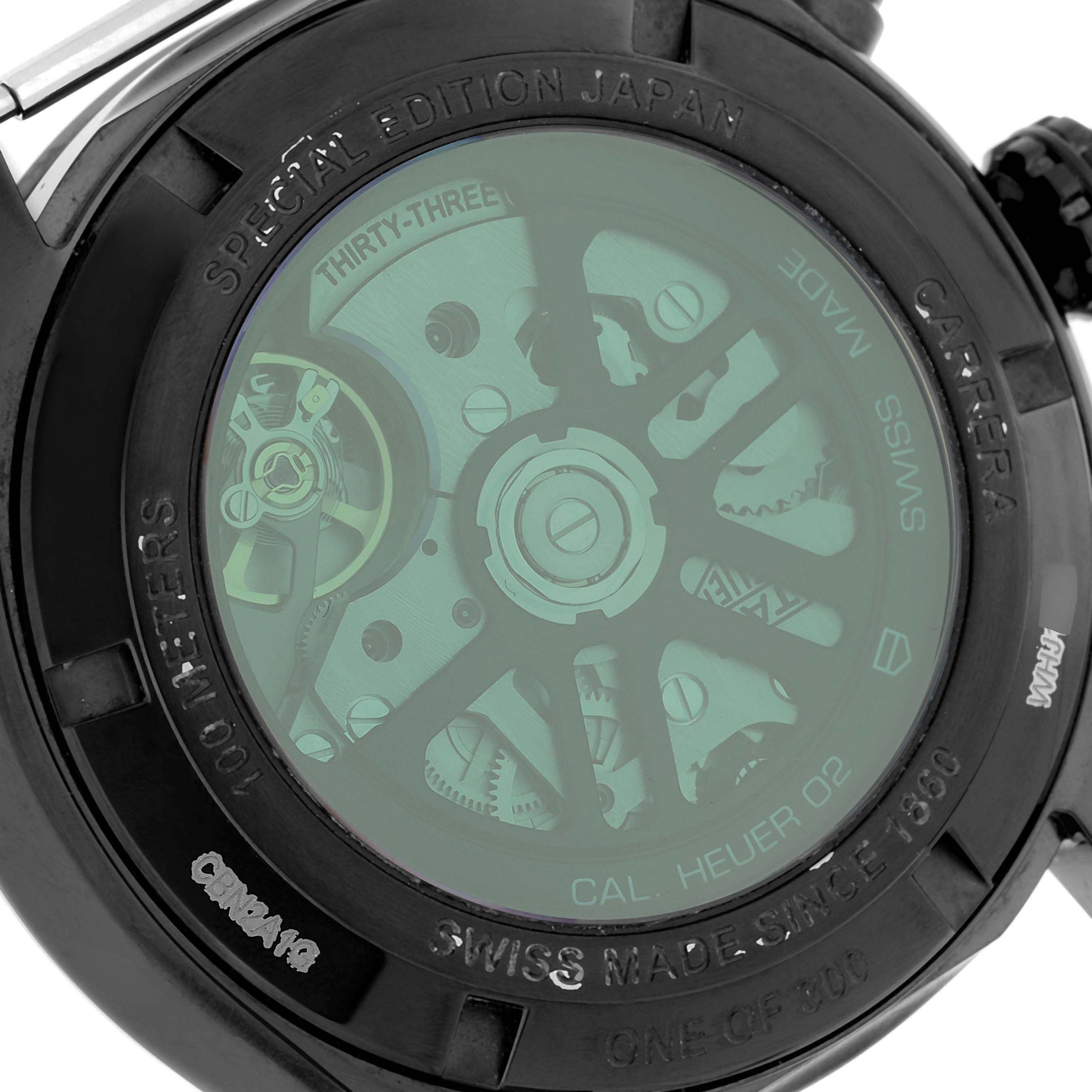 The image shows the back of a Tag Heuer Carrera CBN2A1G.FC6501 Men
s Stainless Steel Black Dial CBN2A1G.FC6501 Men
s Stainless Steel Black Dial watch, highlighting the exposed mechanism and engravings.