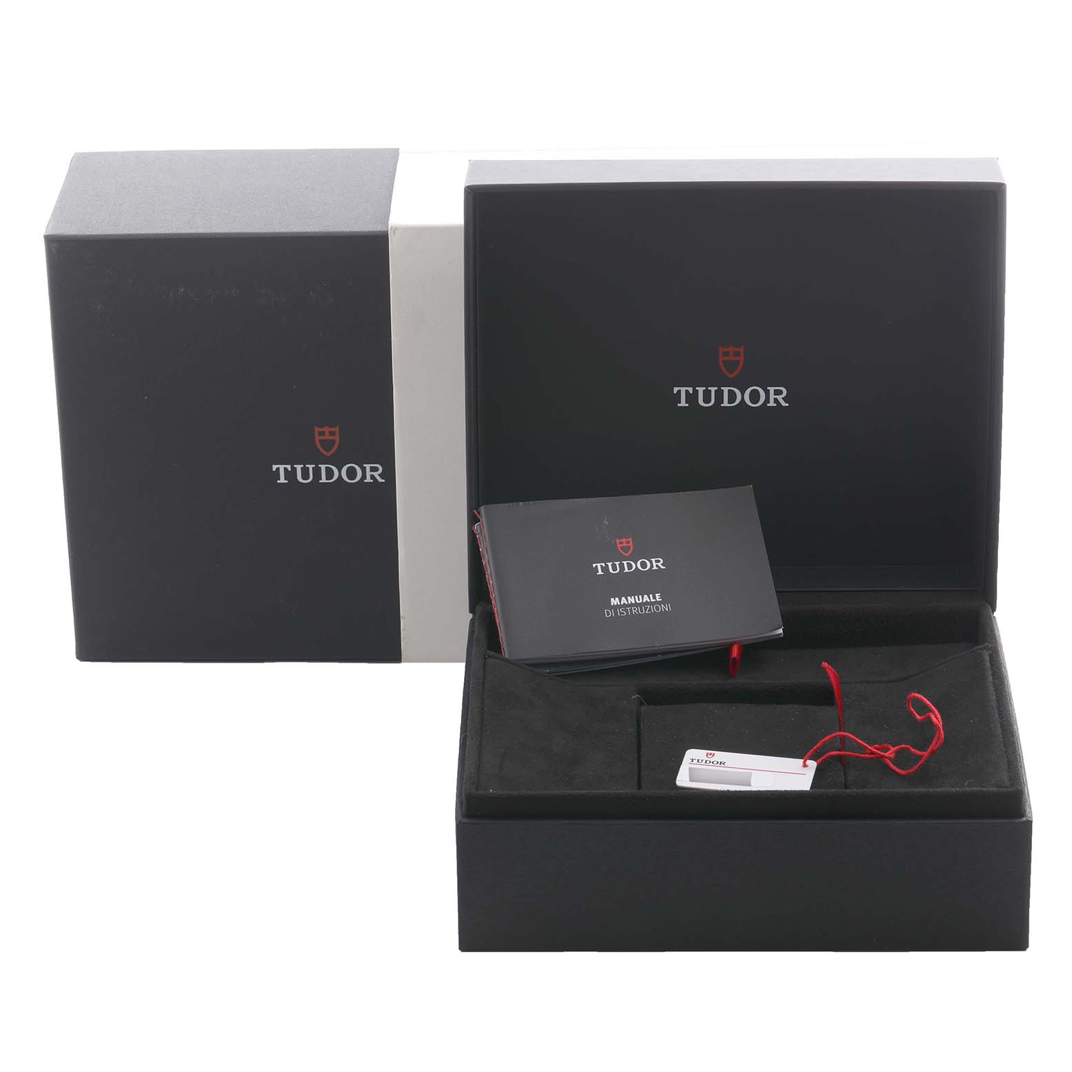 The image shows the Tudor Heritage Black Bay 79470 Men's Stainless Steel Black Dial 79470 Men's Stainless Steel Black Dial watch packaging, including an open box, booklet, and a tag.