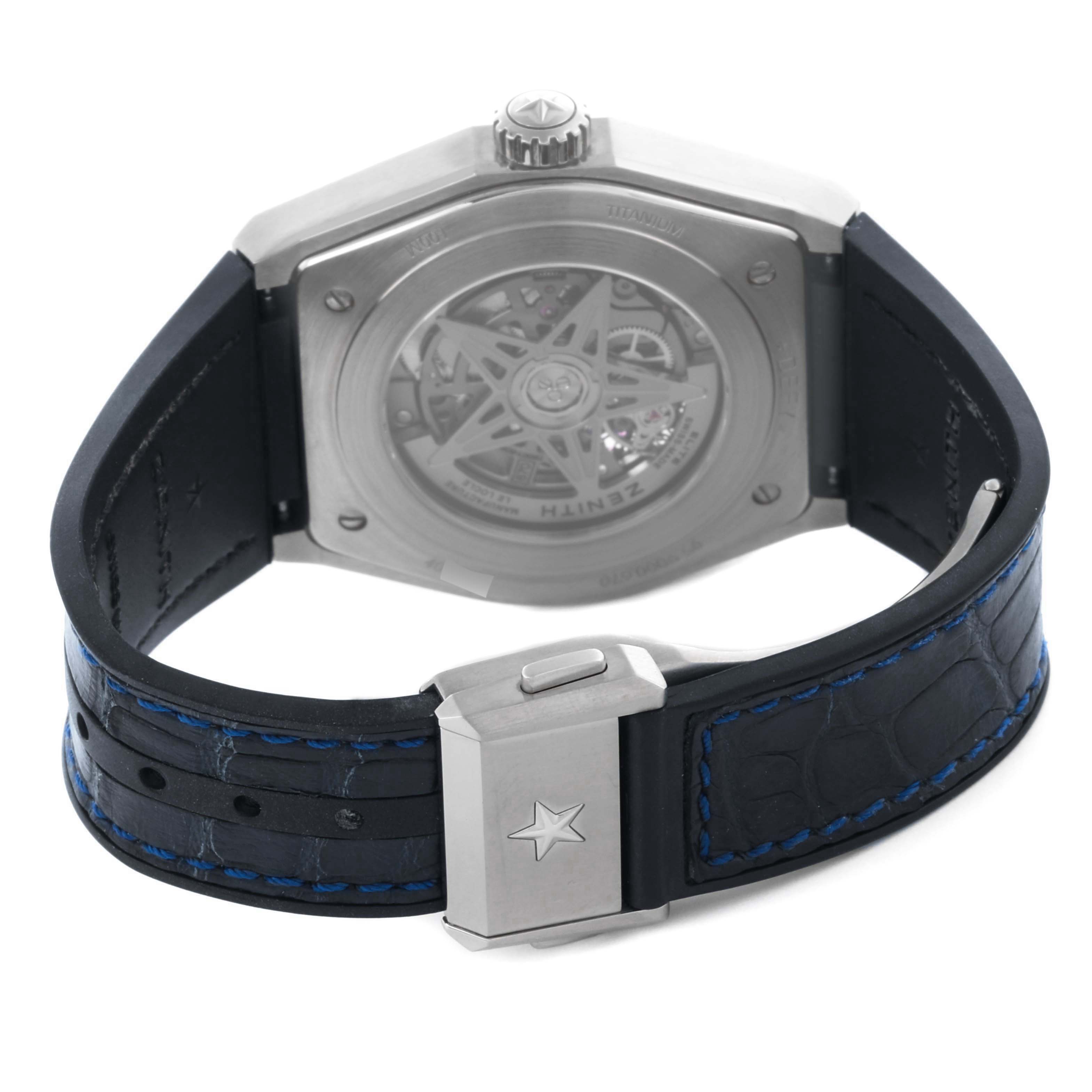 The Zenith Defy 95.9000.670 Men
s Stainless Steel Grey Dial 95.9000.670 Men
s Stainless Steel Grey Dial watch is shown from the back, highlighting the case back, strap, and clasp with visible stitching.