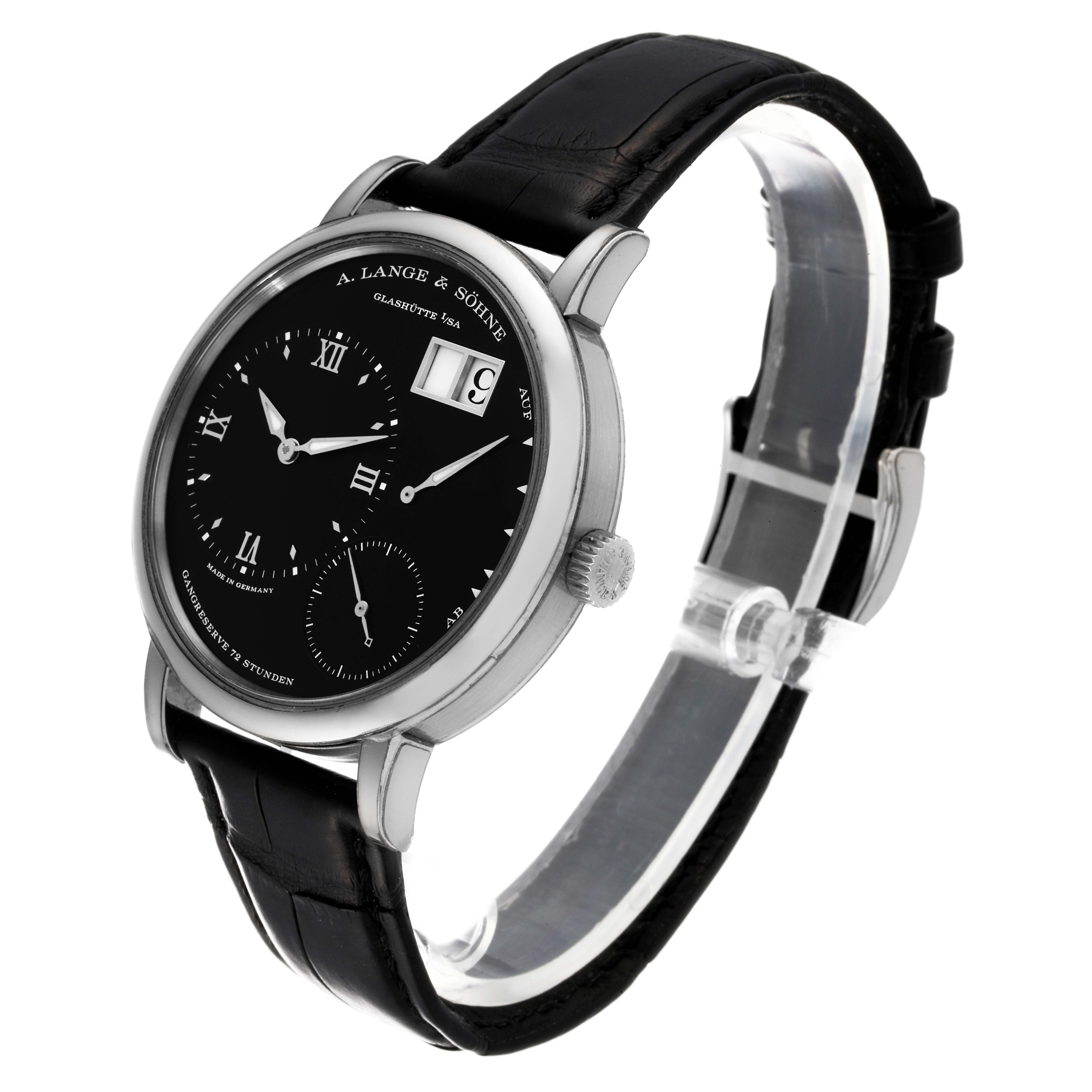 The Richard Lange model by A. Lange & Söhne is shown at an angle, displaying its black dial, subdials, date window, and black leather strap.