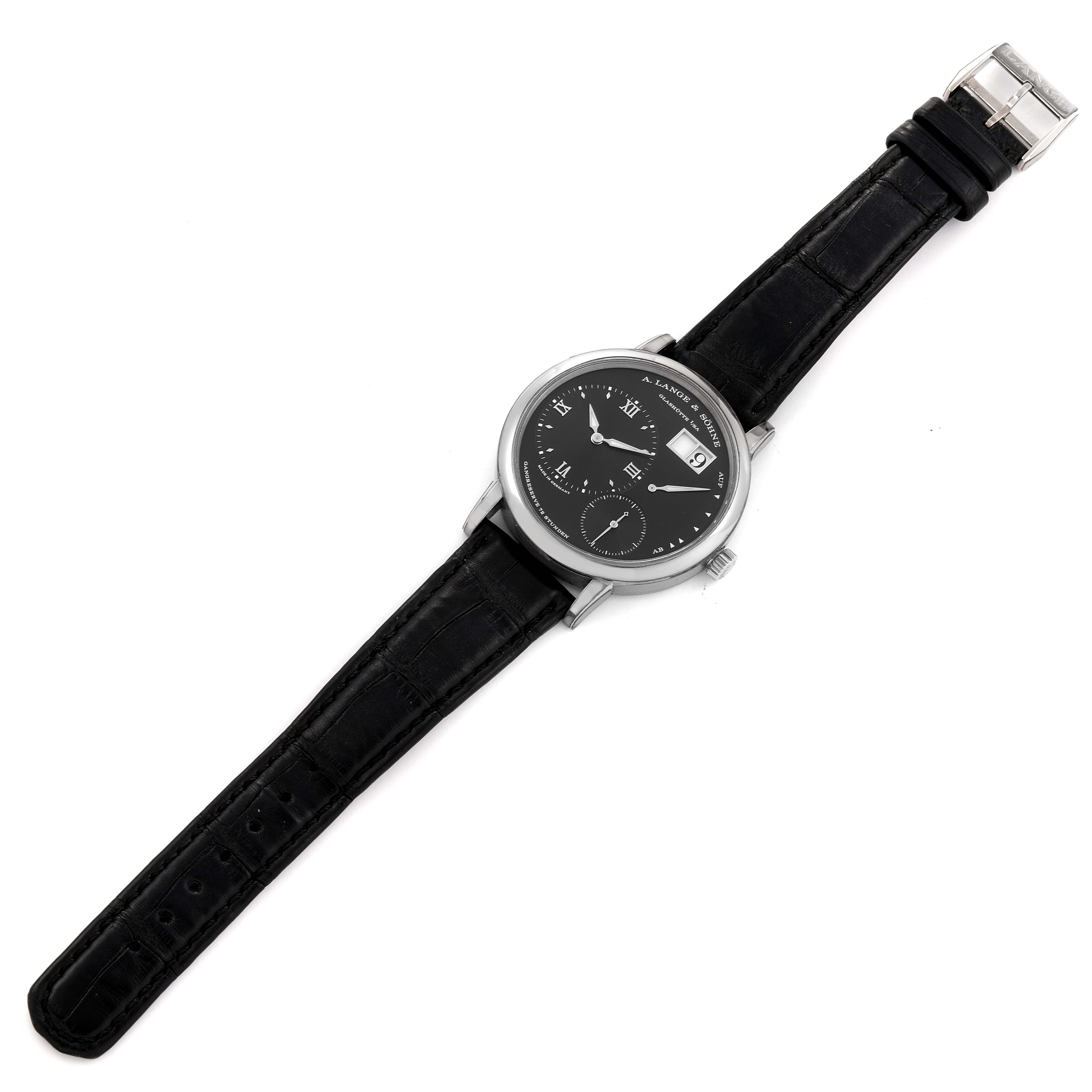 This is a top view of the Richard Lange model by A. Lange & Söhne, showing its black dial, silver case, and black leather strap.