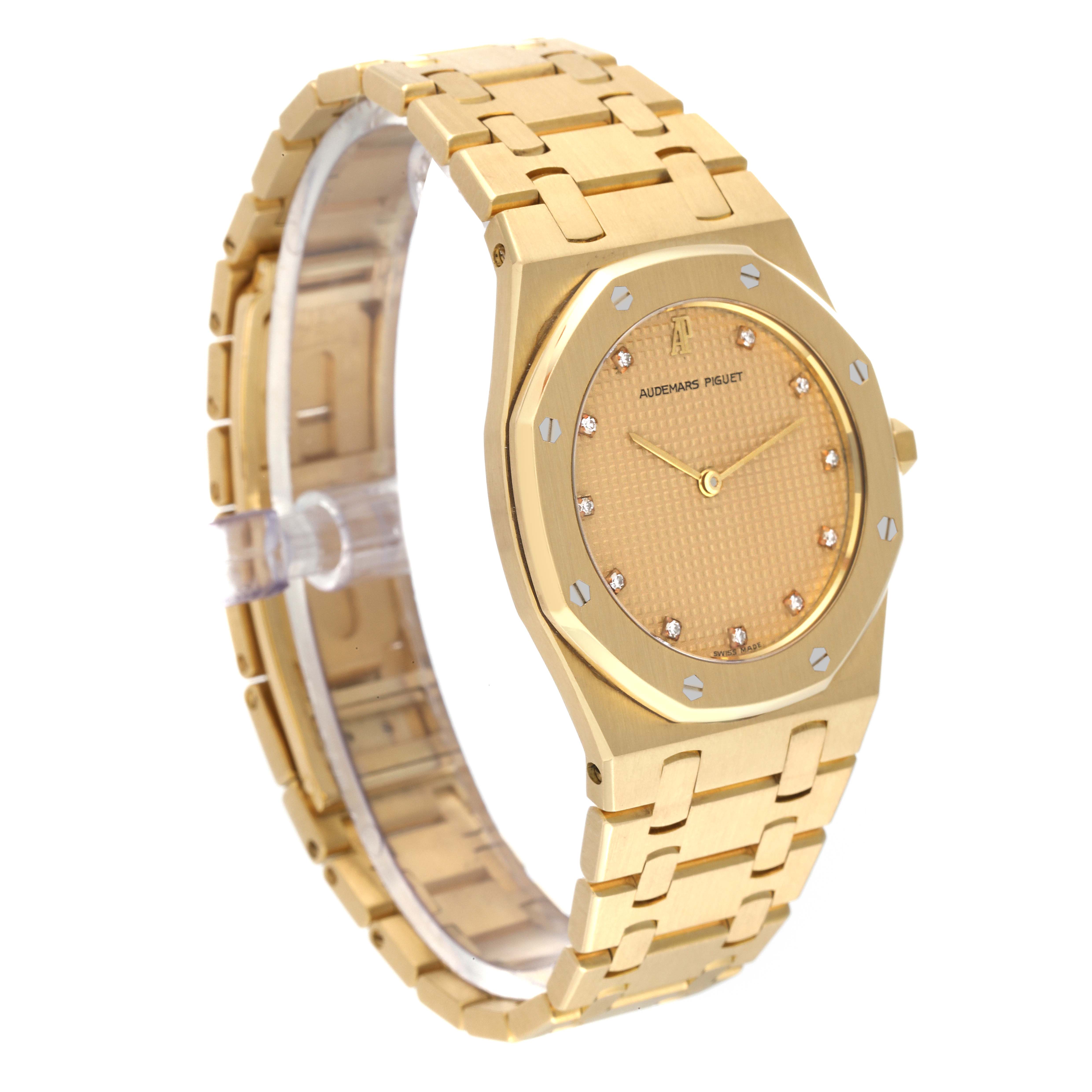 The image shows a side angle of the Audemars Piguet Royal Oak 56303BA Men's Yellow Gold Champagne Dial 56303BA Men's Yellow Gold Champagne Dial watch, highlighting its bracelet, case, and dial.