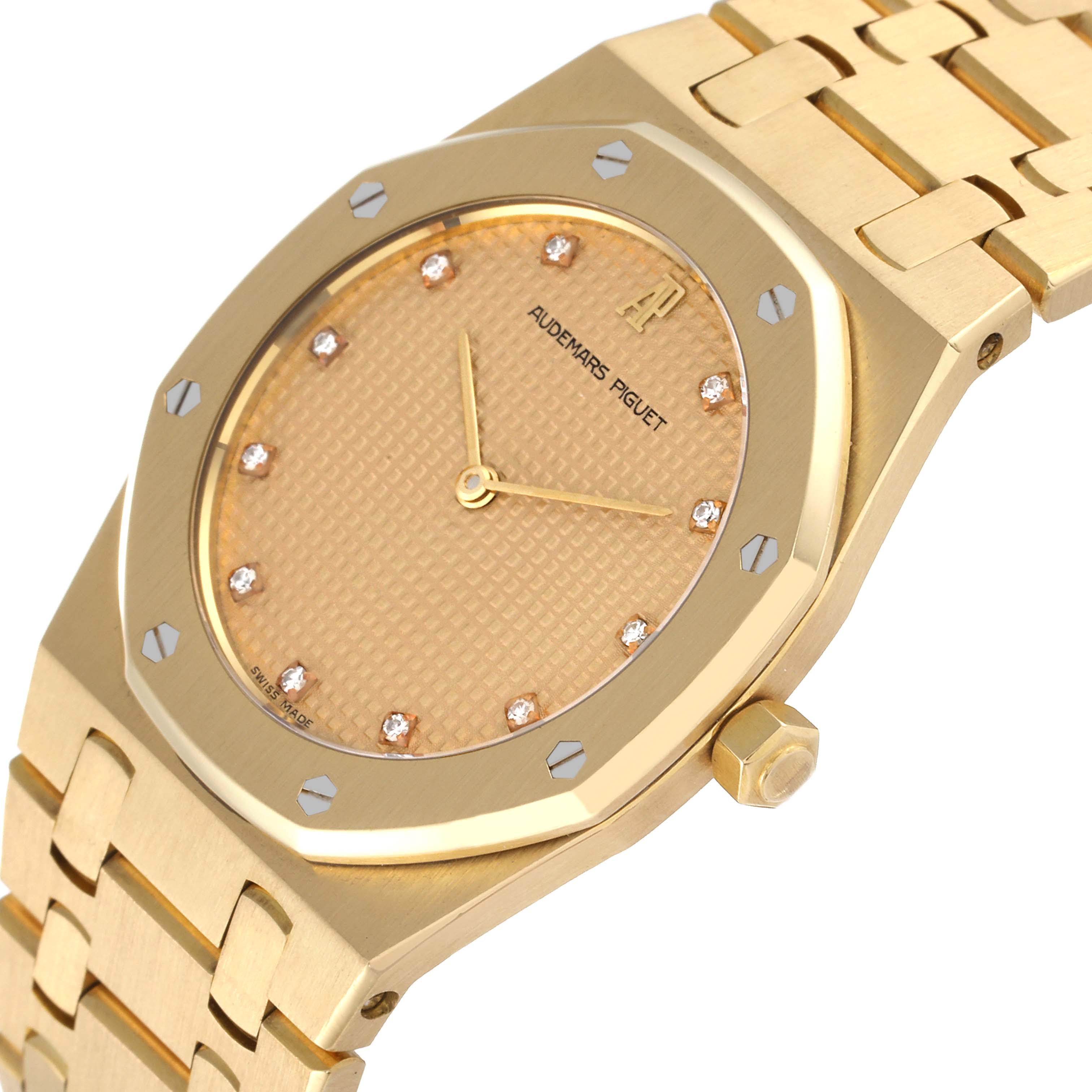 This image shows a close-up angle of an Audemars Piguet Royal Oak 56303BA Men's Yellow Gold Champagne Dial 56303BA Men's Yellow Gold Champagne Dial watch, highlighting the gold dial, bezel, and bracelet.