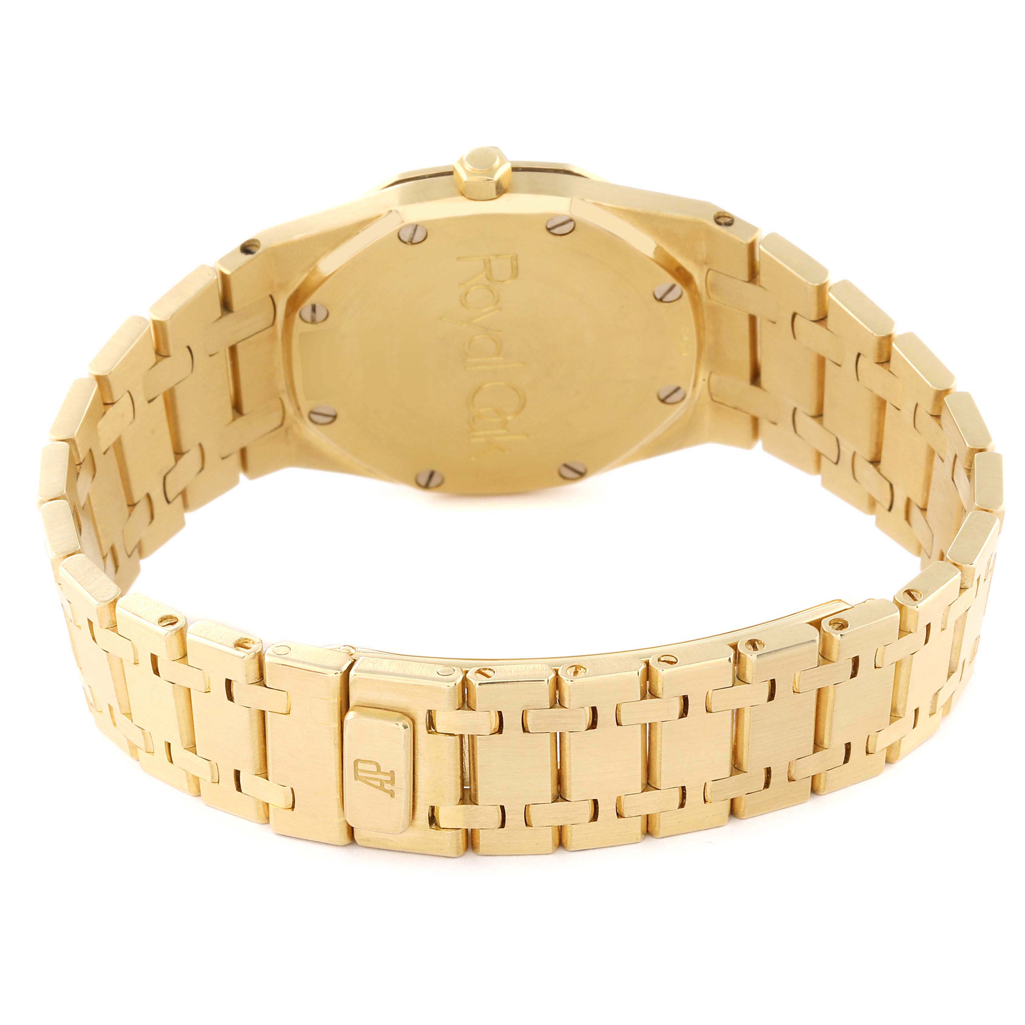 The image shows the back case and bracelet of a gold Audemars Piguet Royal Oak 56303BA Men's Yellow Gold Champagne Dial 56303BA Men's Yellow Gold Champagne Dial watch from a rear angle.