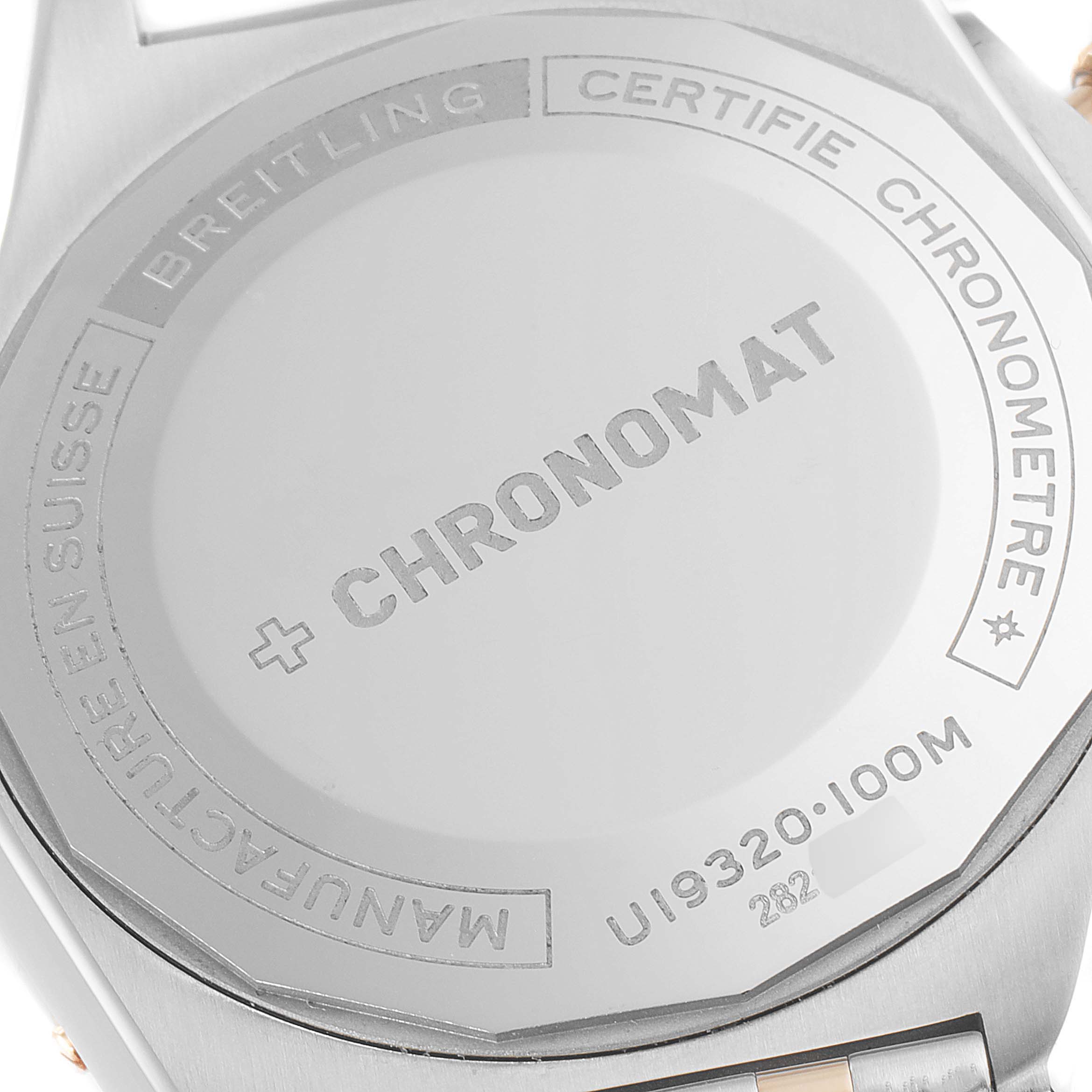 This image shows the case back of a Breitling Chronomat U19320161C1U1 Men's Steel and Gold (two tone) Blue Dial U19320161C1U1 Men's Steel and Gold (two tone) Blue Dial watch, highlighting the model name and certification details.