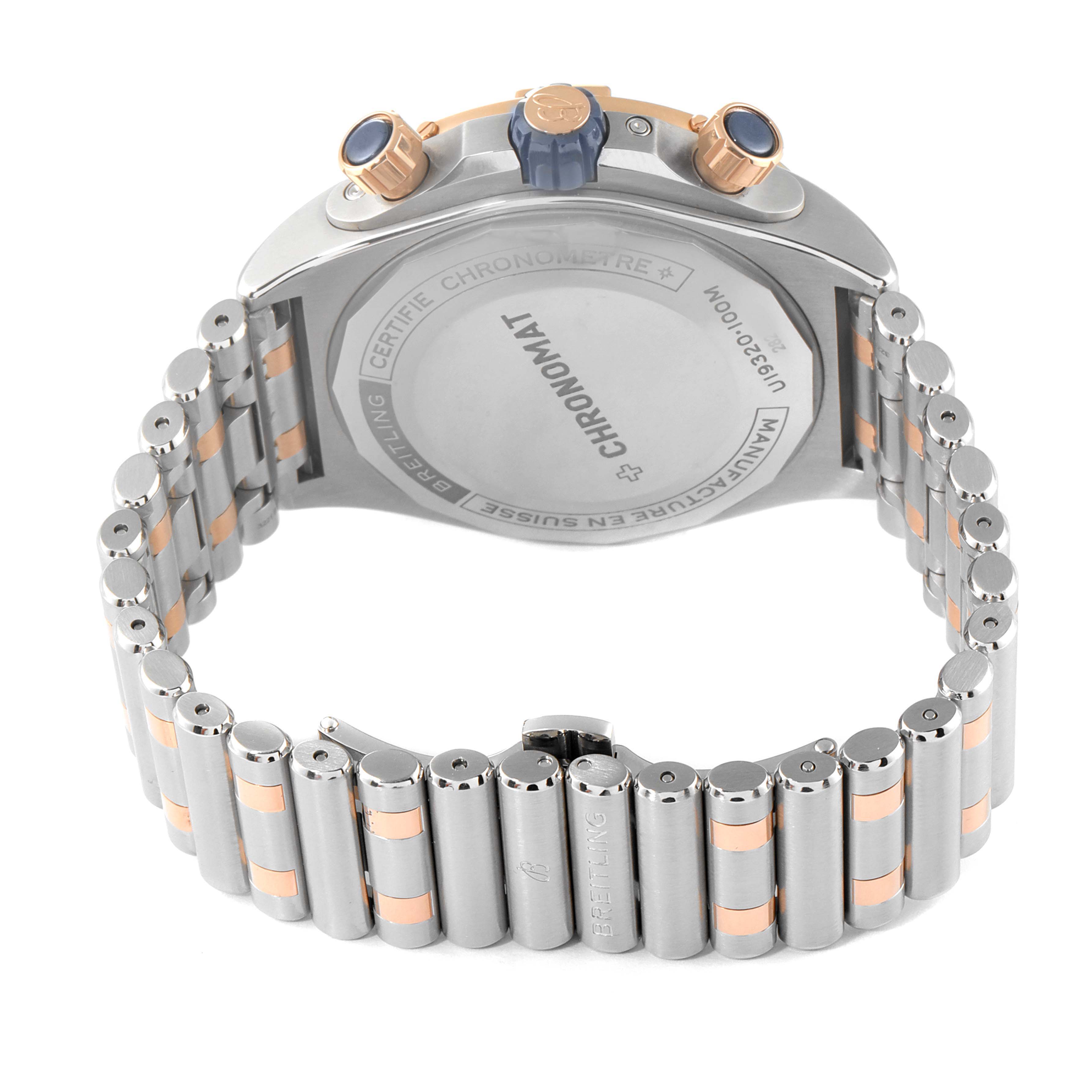 The image shows the back view of a Breitling Chronomat U19320161C1U1 Men's Steel and Gold (two tone) Blue Dial U19320161C1U1 Men's Steel and Gold (two tone) Blue Dial watch, highlighting its case back, pushers, and bracelet.