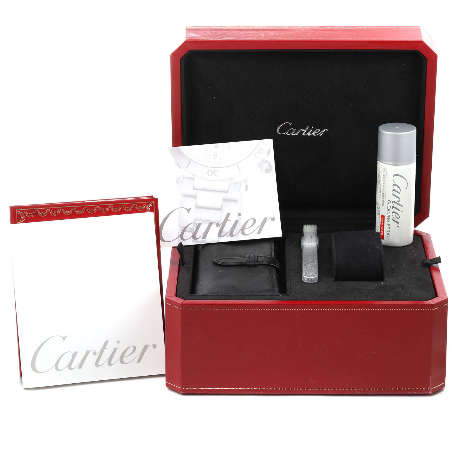 The image shows a Cartier Roadster W62019X6 Men
s Stainless Steel Silver Dial W62019X6 Men
s Stainless Steel Silver Dial watch accessories kit, including a box, cleaning brush, extra strap, manual, and a bottle of cleaner.