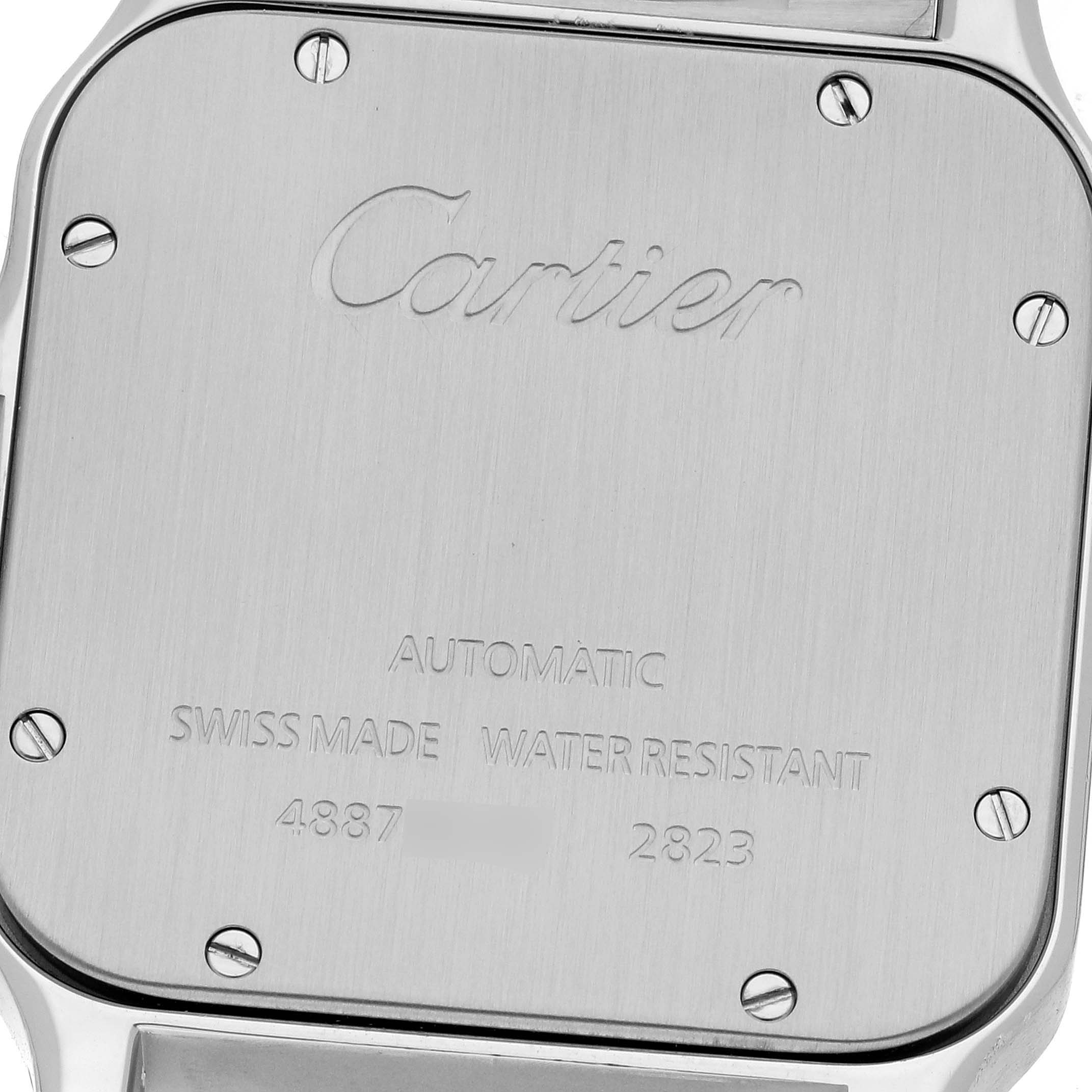 This image shows the back case of a Santos model by Cartier, displaying its engravings and screws.