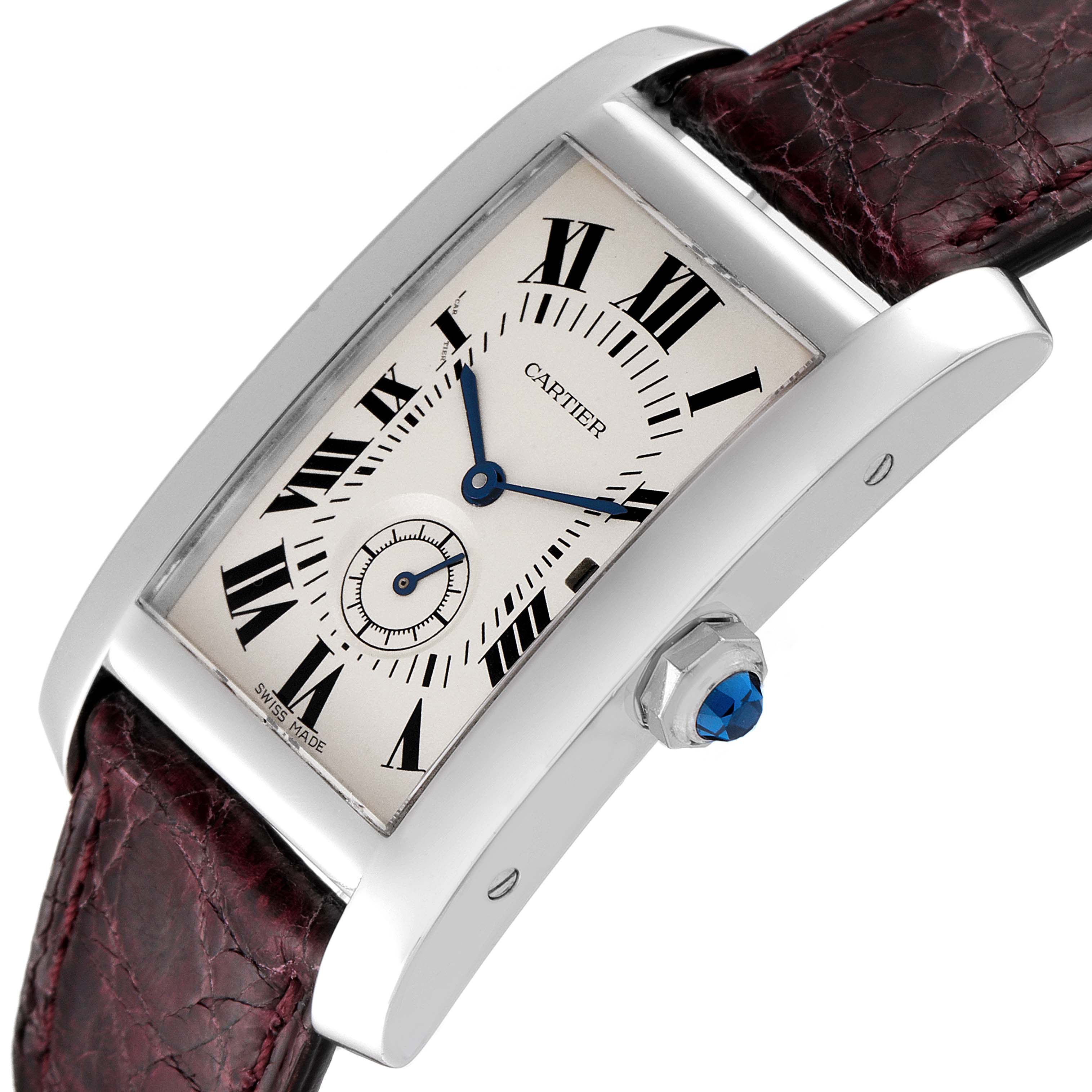 The image shows a Cartier Tank Américaine watch angled to display the face, crown, and a portion of the leather strap.