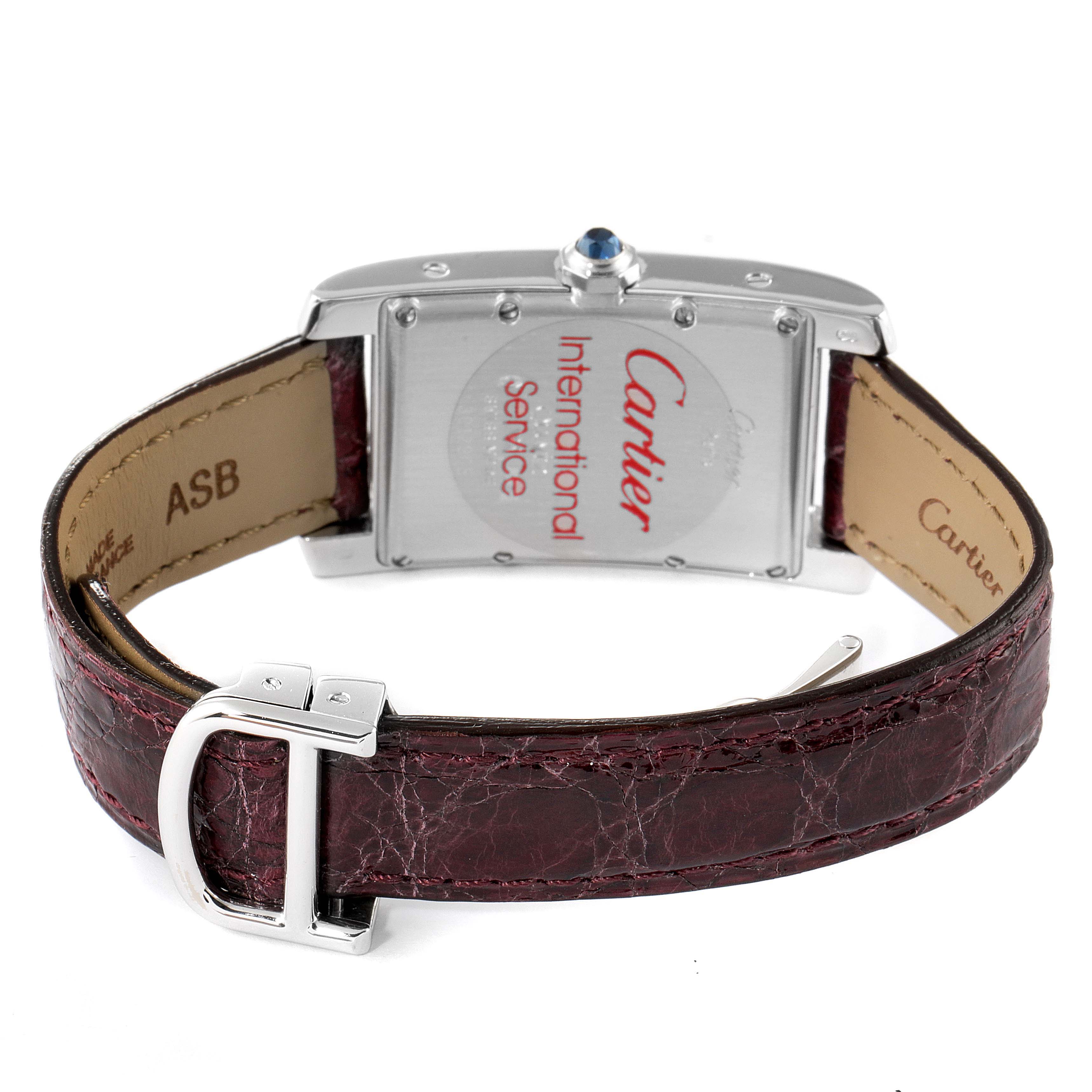 The image shows the back view of a Cartier Tank Americaine 3012905 Women's White Gold Silver Dial 3012905 Women's White Gold Silver Dial watch, highlighting its case back, leather strap, and buckle.