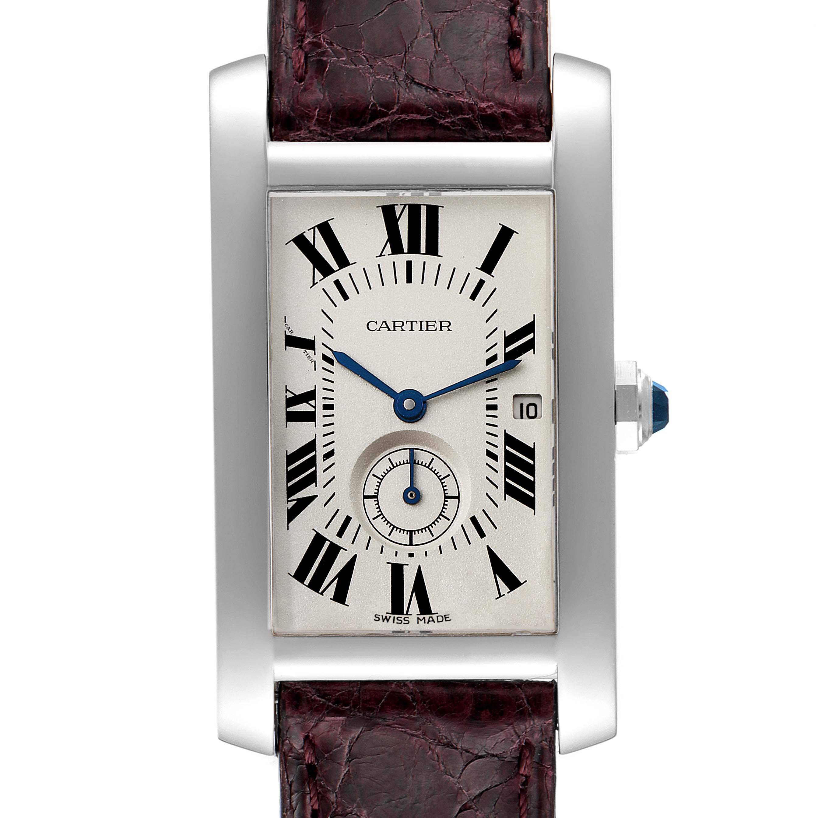 The image shows a Cartier Tank Américaine watch, focusing on its rectangular face, Roman numerals, and a portion of its leather strap.