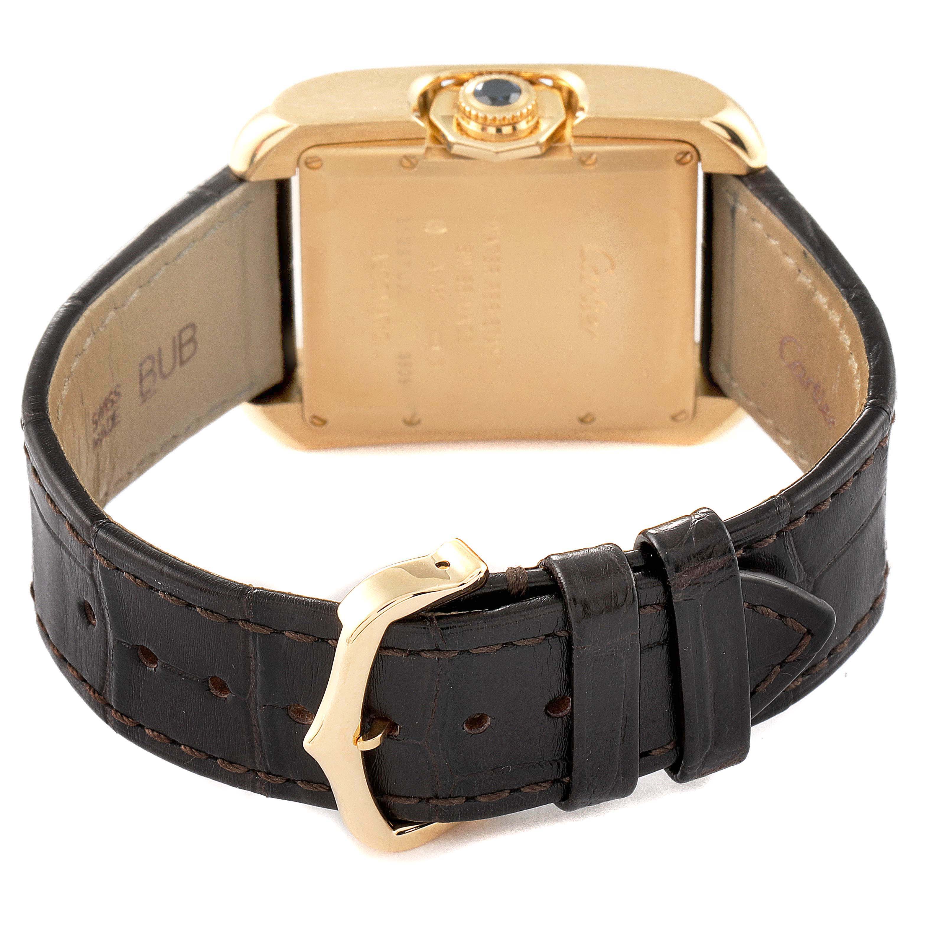 The image shows the back of the Cartier Tank Anglaise W5310030 Men's Yellow Gold Silver Dial W5310030 Men's Yellow Gold Silver Dial watch, including the leather strap, buckle, and case back.