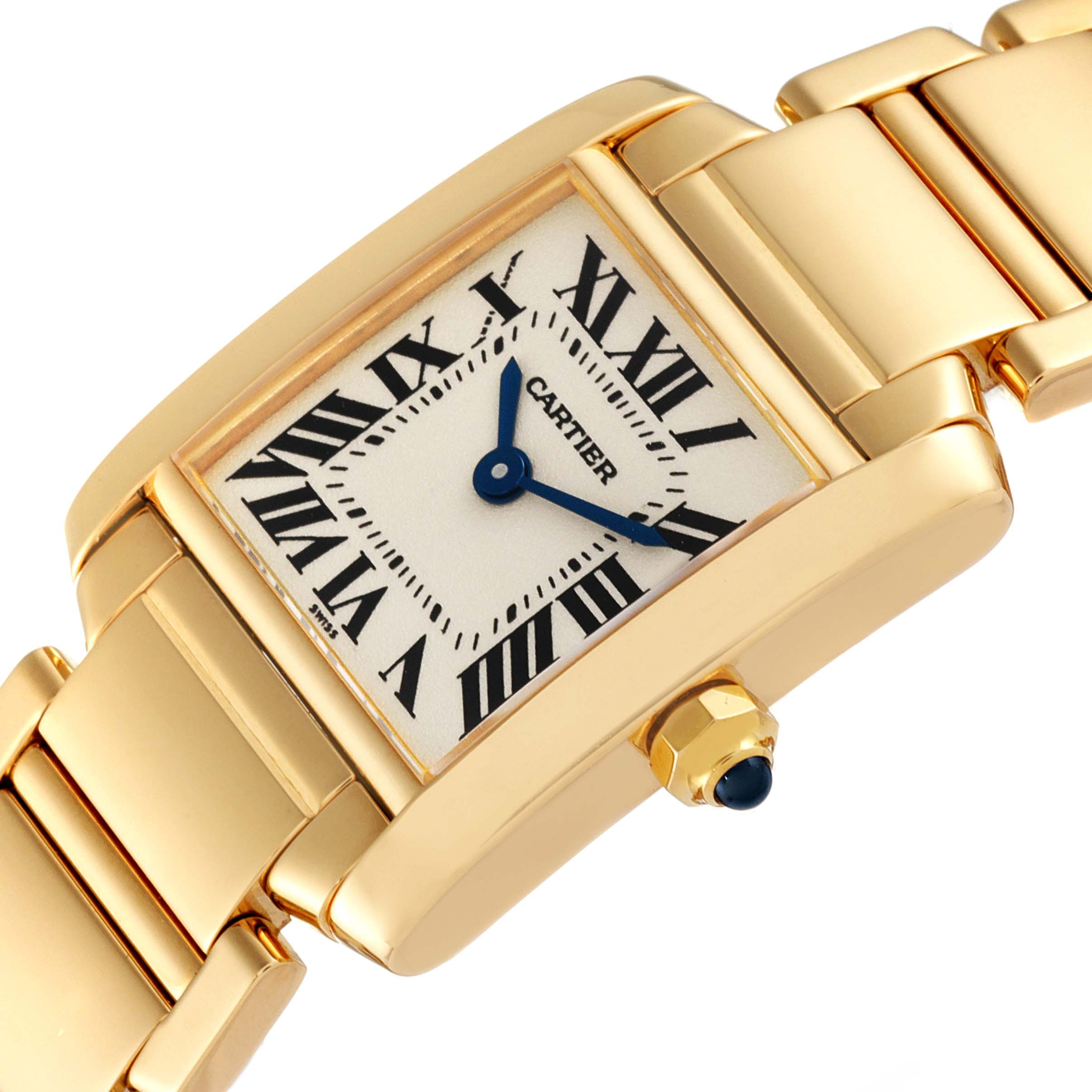 This image shows a close-up, angled view of the Cartier Tank Francaise W50002N2 Women
s Yellow Gold Silver Dial W50002N2 Women
s Yellow Gold Silver Dial watch face and part of the bracelet.