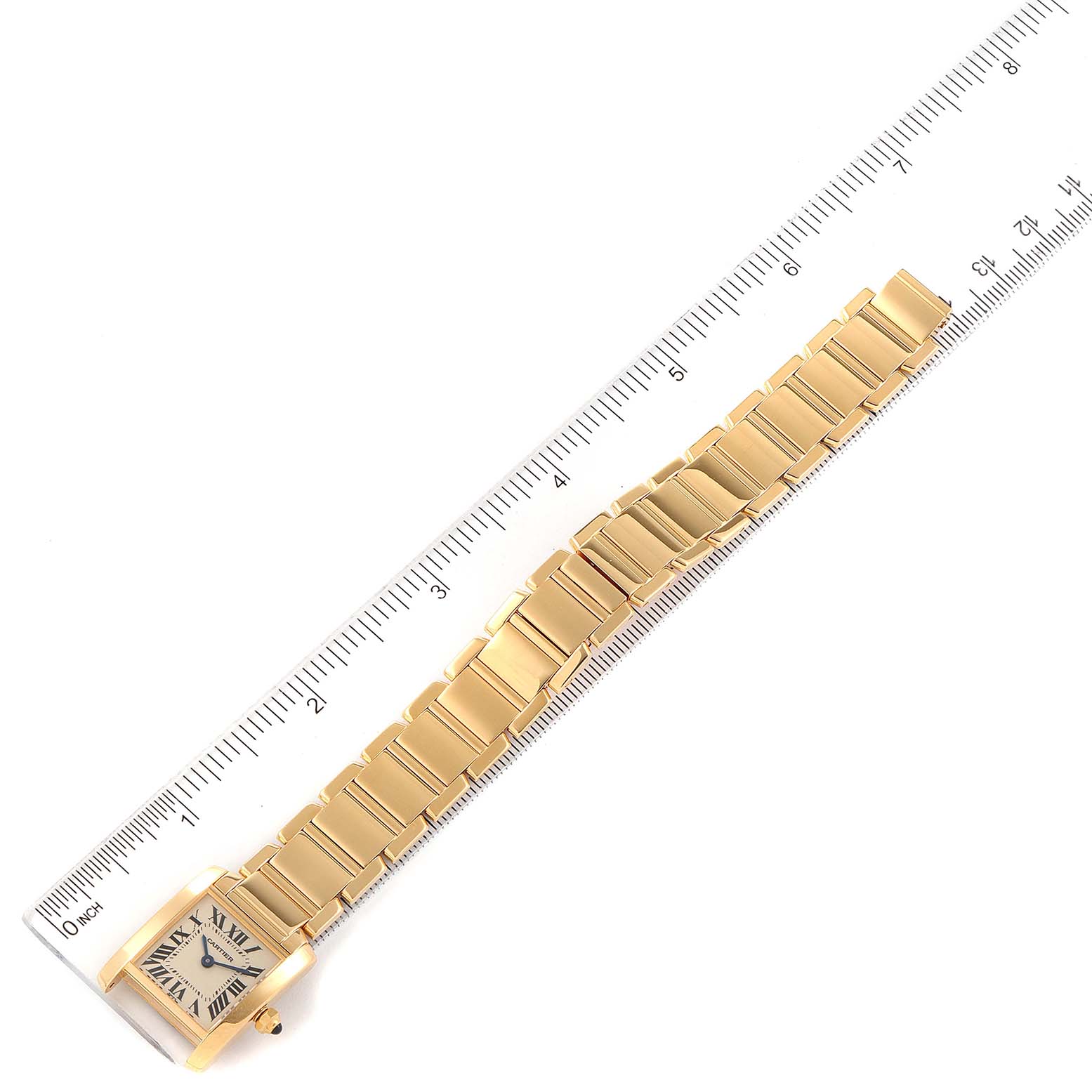 The Cartier Tank Francaise W50002N2 Women
s Yellow Gold Silver Dial W50002N2 Women
s Yellow Gold Silver Dial watch is shown from an overhead angle, displaying the entire strap against a ruler for scale.