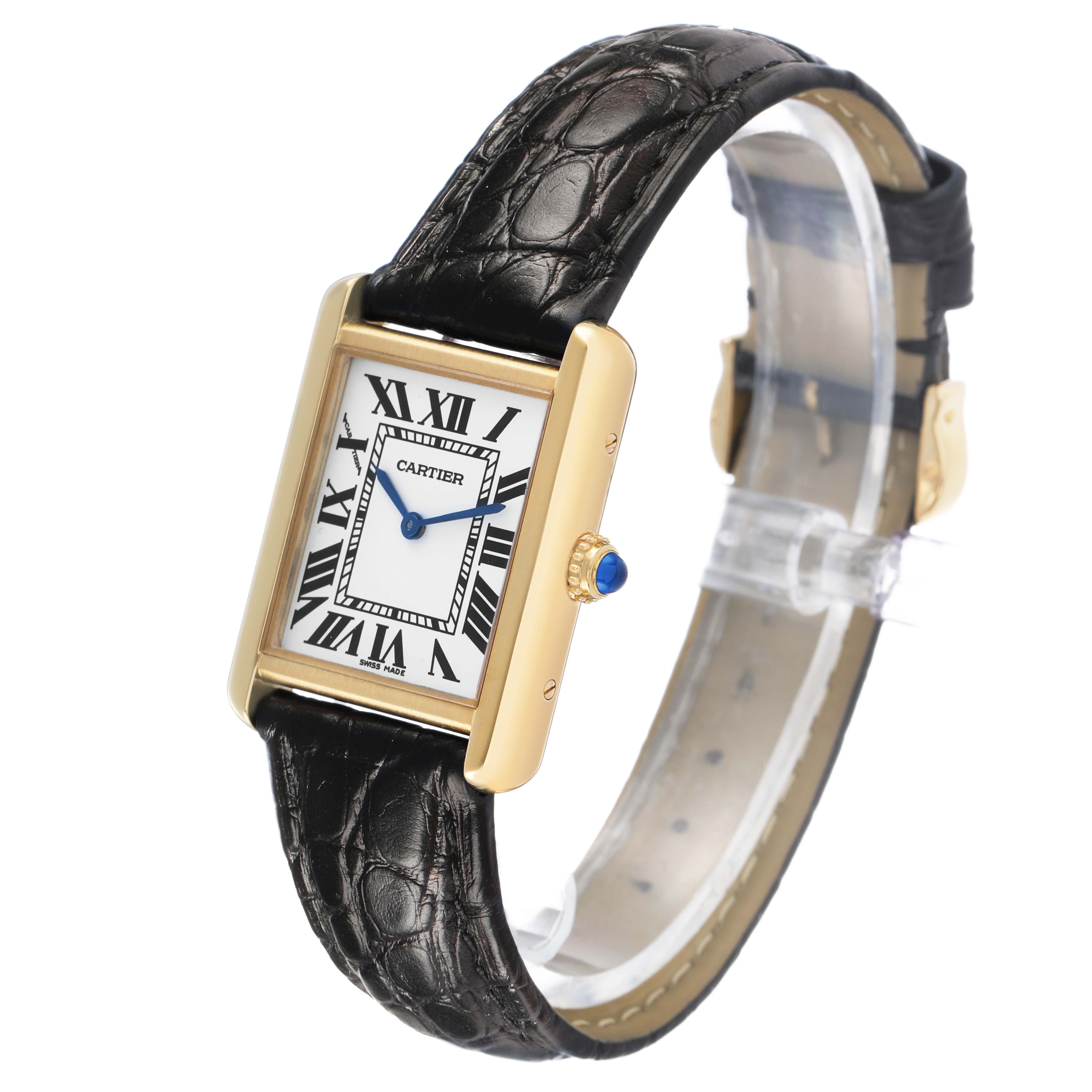 The Cartier Tank Solo W5200002 Women's Yellow Gold Silver Dial watch is shown at an angled view, displaying its face, crown, and leather strap.
