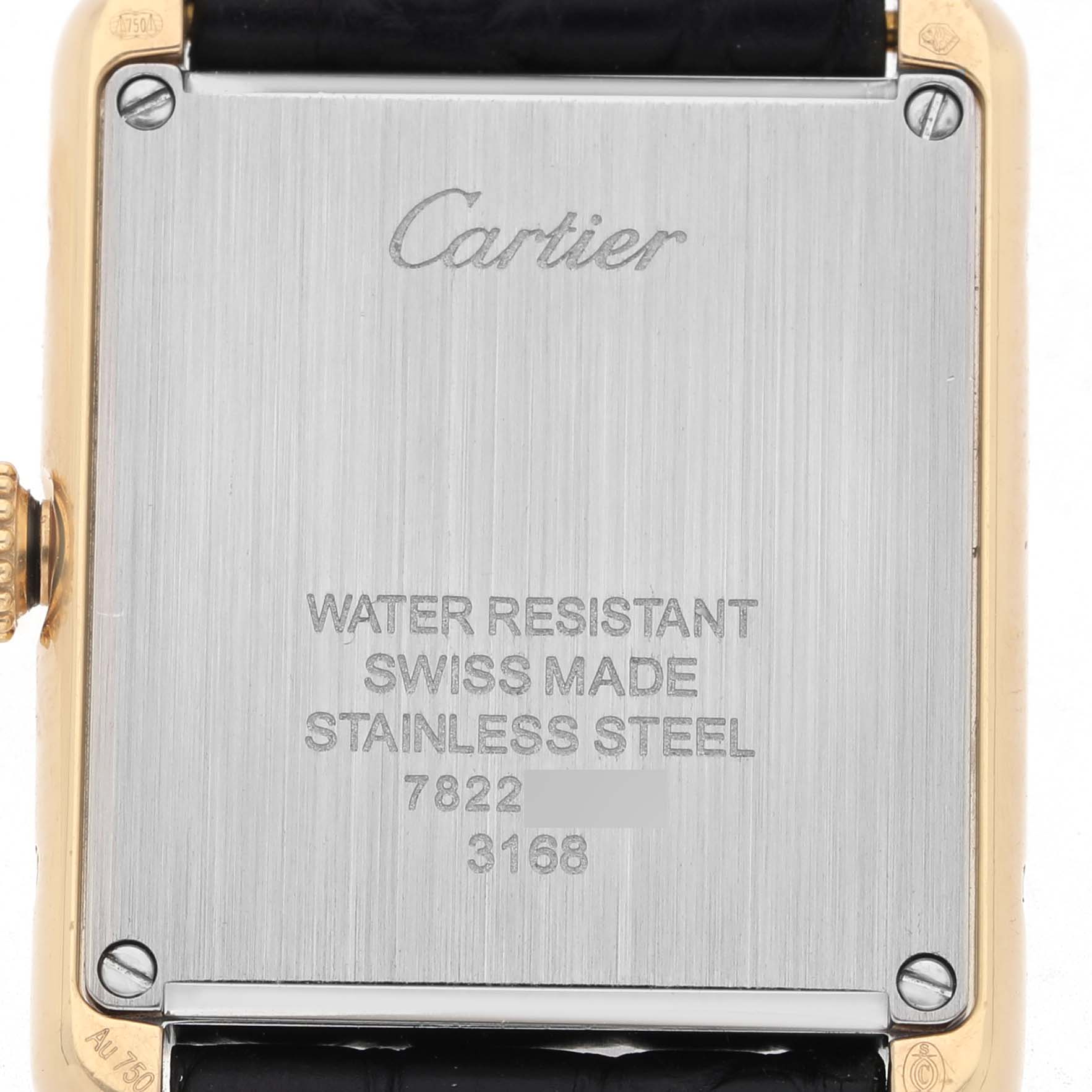 The image shows the back of the Cartier Tank Solo W5200002 Women's Yellow Gold Silver Dial watch, highlighting its stainless steel casing and markings.