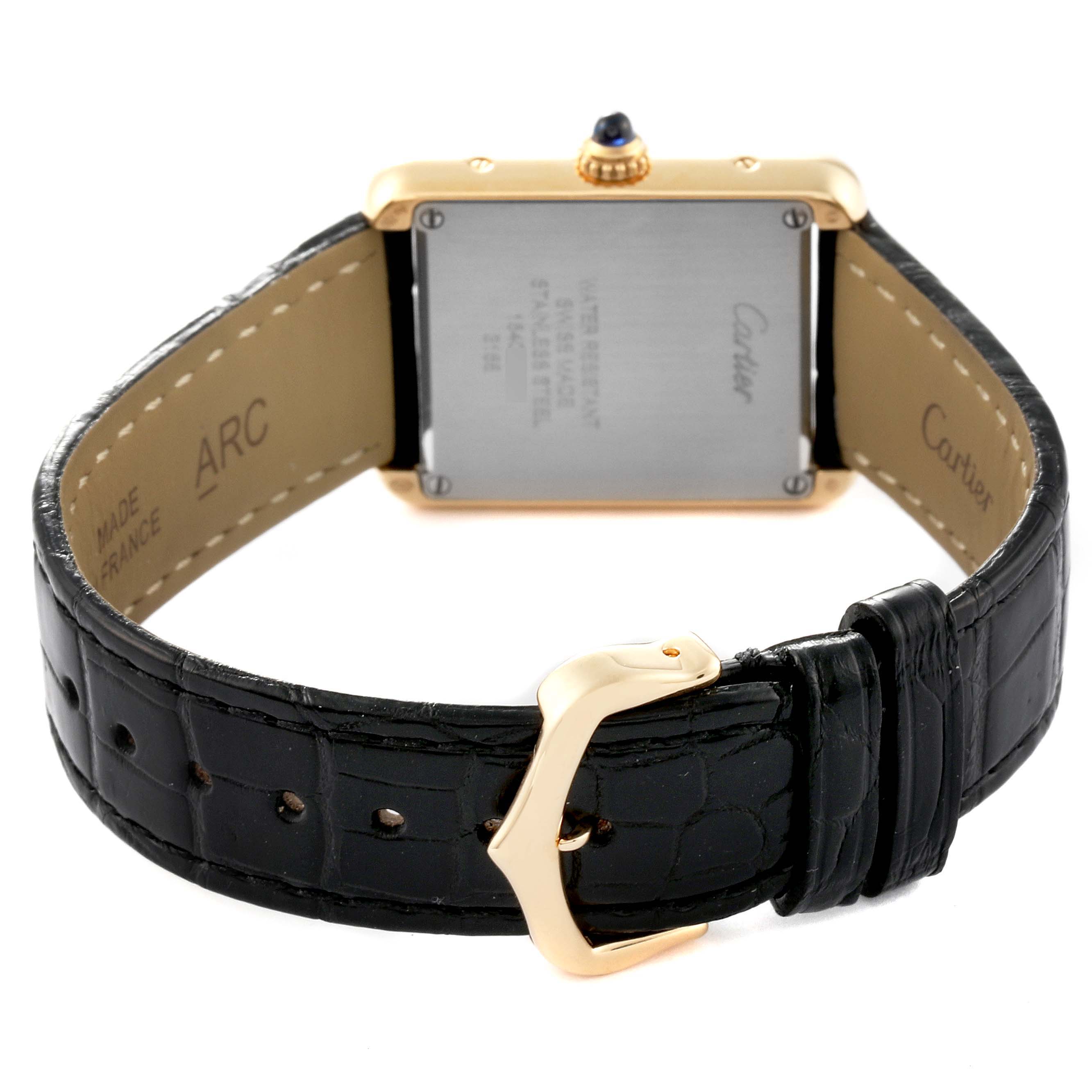 The image shows the back of a Tank Solo watch by Cartier, focusing on the case back, strap, and buckle.