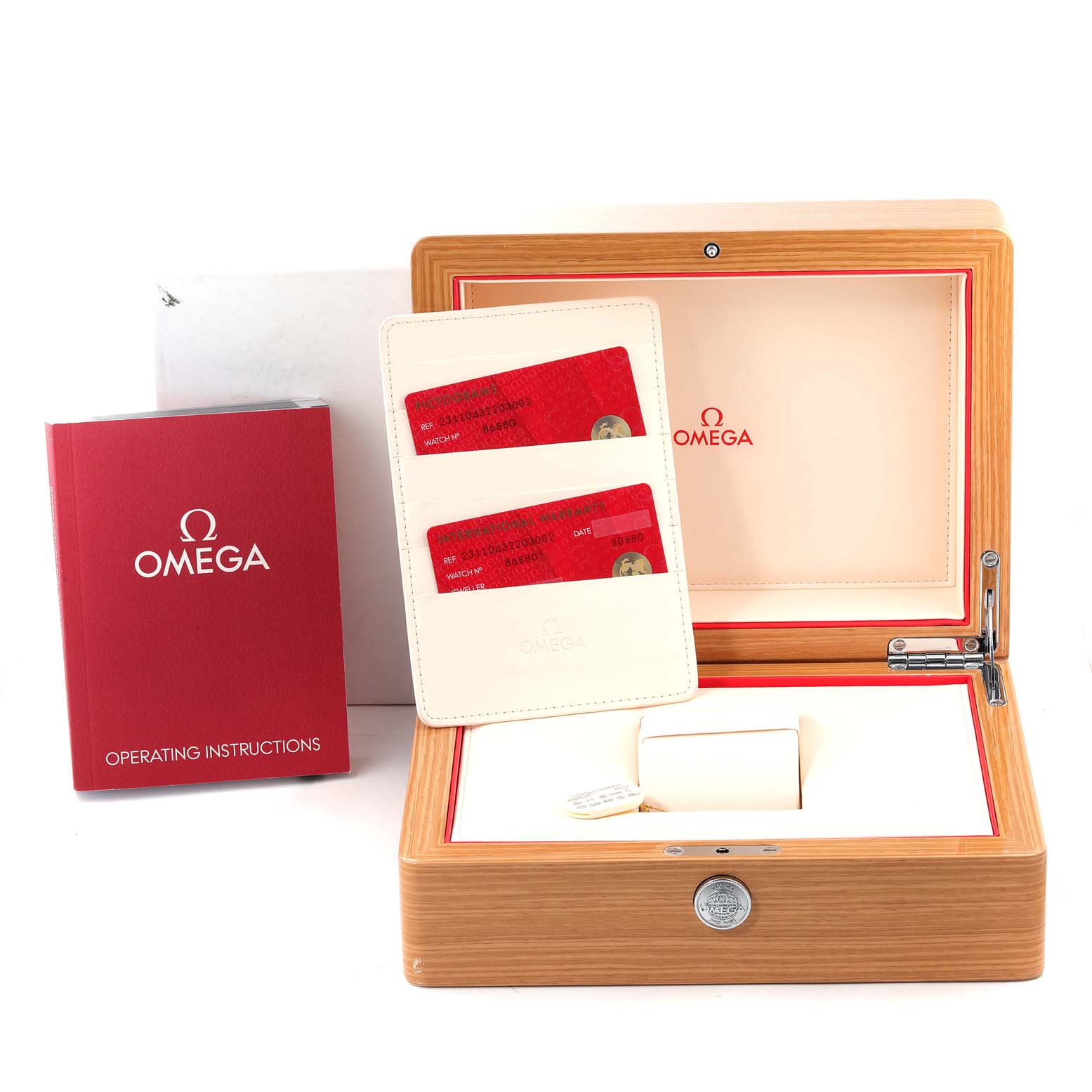 This image shows the Omega Aqua Terra 231.10.43.22.03.002 Men's Stainless Steel Blue Dial 231.10.43.22.03.002 Men's Stainless Steel Blue Dial watch box, operating instructions booklet, and cards in a holder from an angled top-down view.