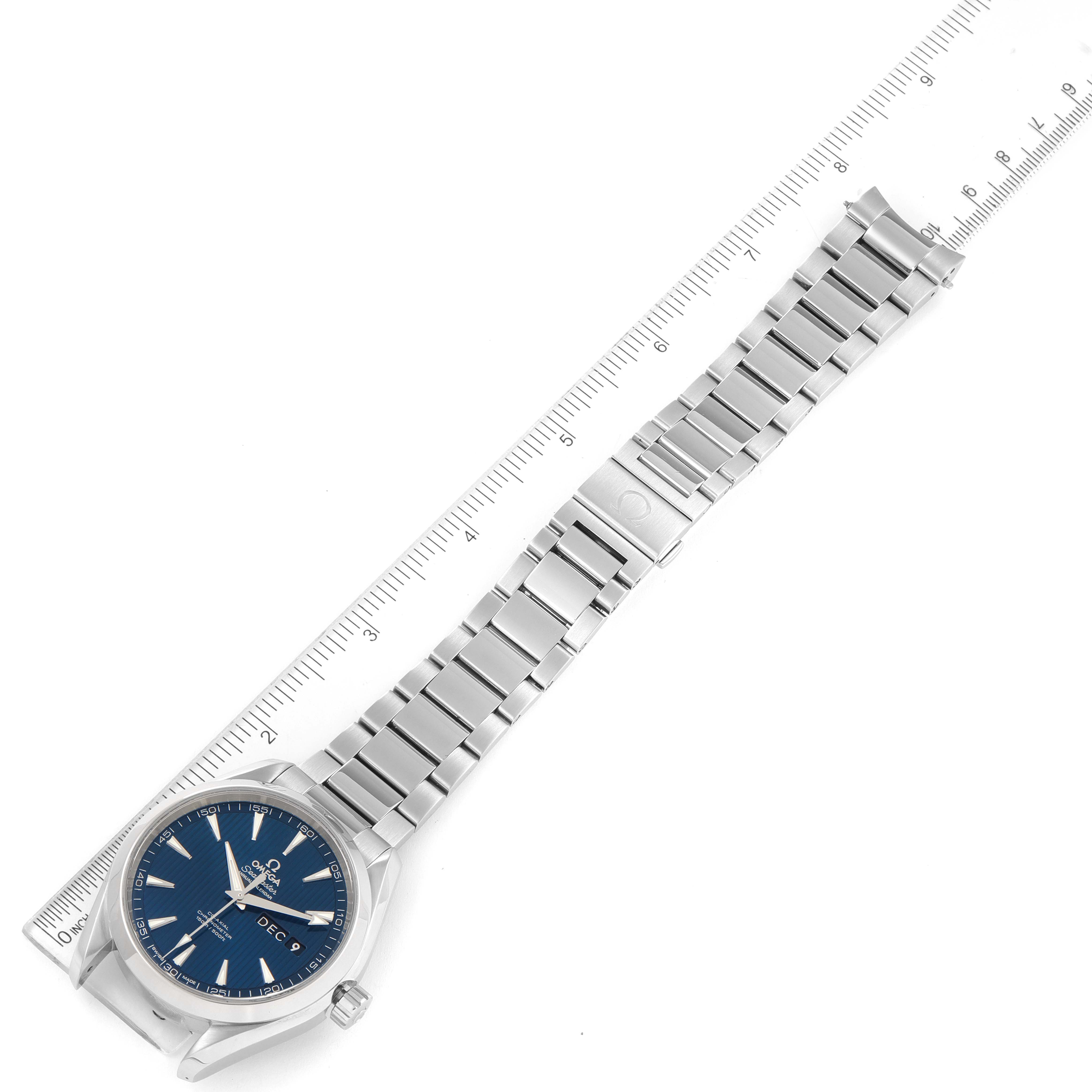 The Omega Aqua Terra 231.10.43.22.03.002 Men's Stainless Steel Blue Dial 231.10.43.22.03.002 Men's Stainless Steel Blue Dial watch is displayed at an angle, showing its face, stainless steel bracelet, and clasp, alongside a measuring ruler.