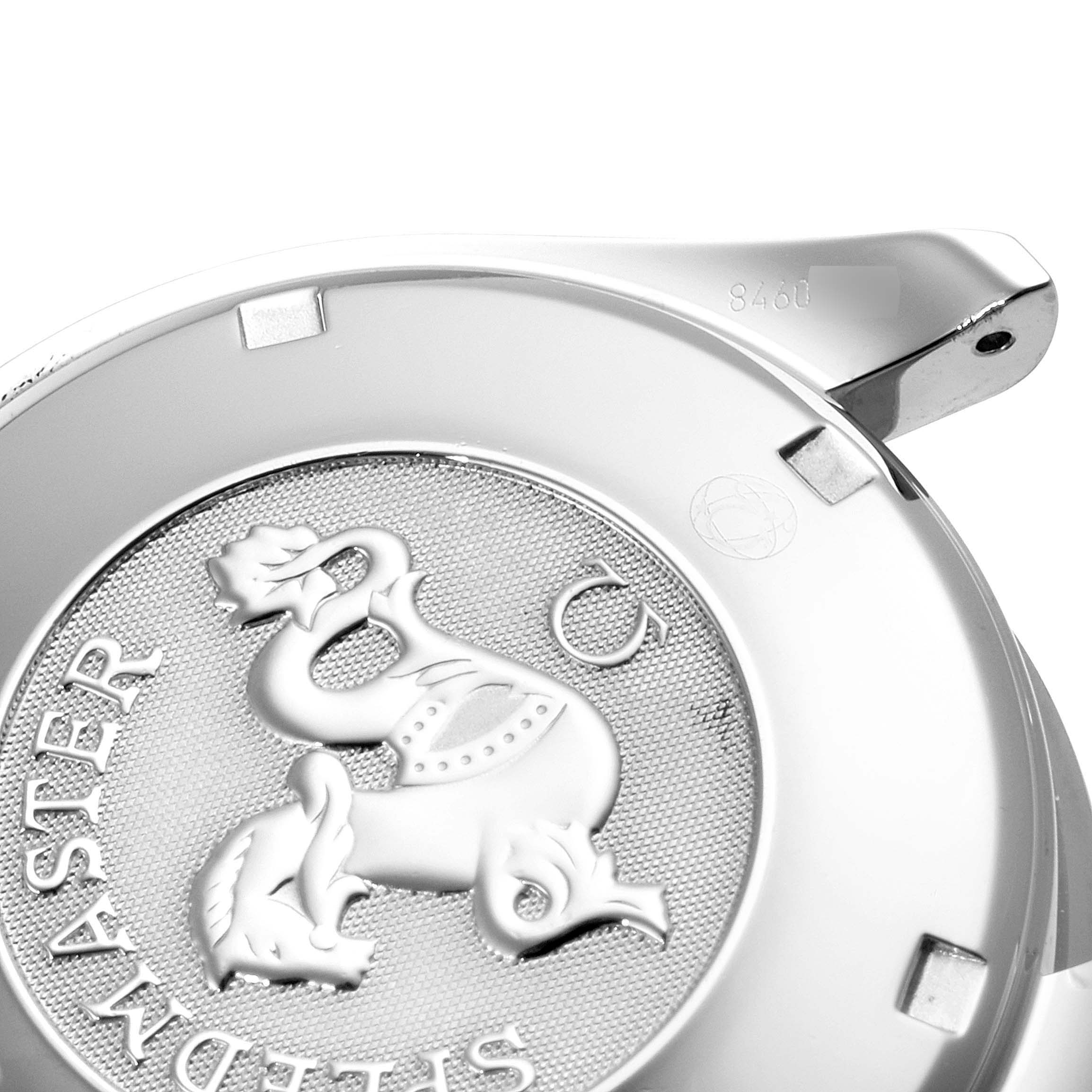 The image shows a partial back view of an Omega Speedmaster 3222.80.00 Men
s Stainless Steel Blue Dial 3222.80.00 Men
s Stainless Steel Blue Dial watch case with its emblem and engraved text.