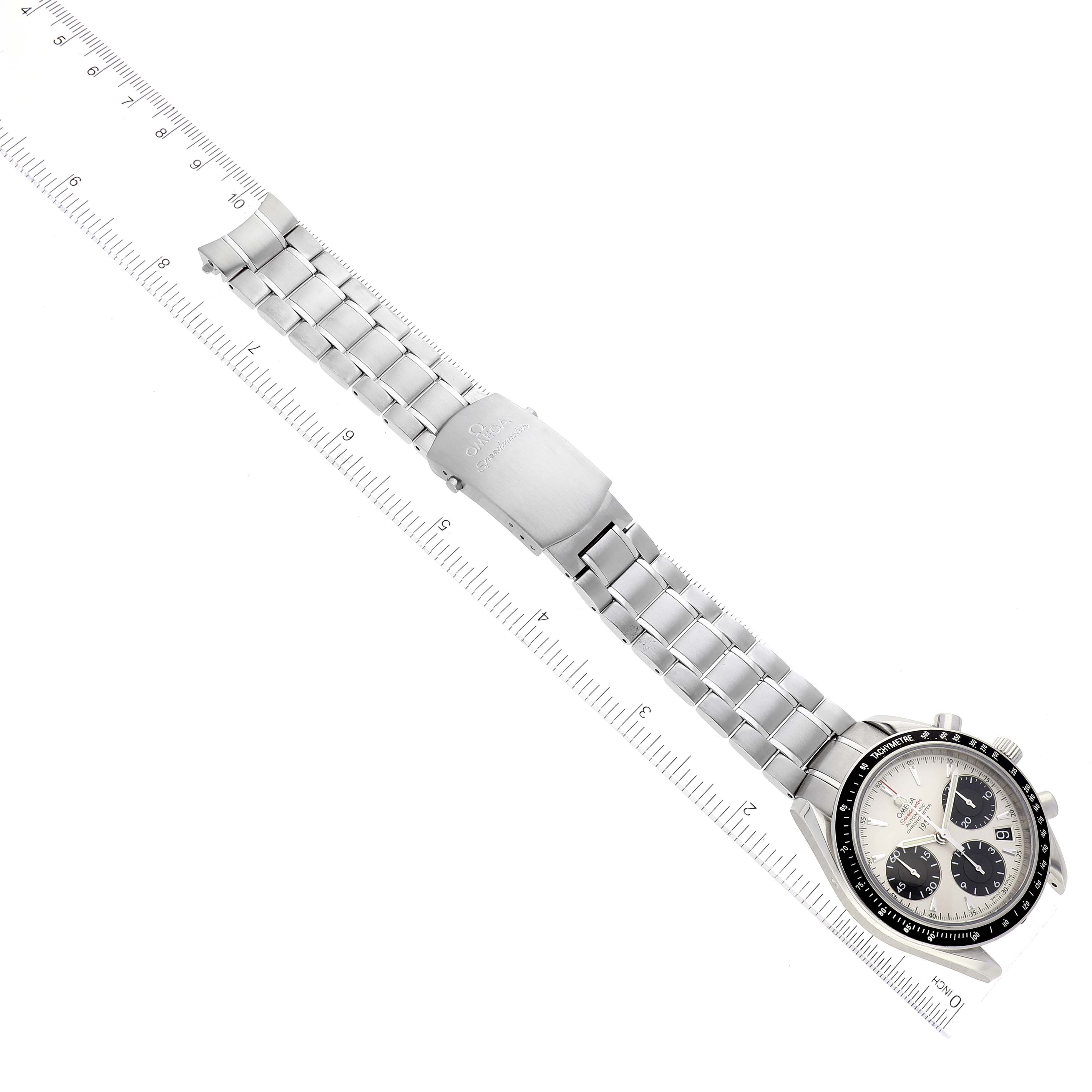 The image shows a top-down view of an Omega Speedmaster 323.30.40.40.02.001 Men's Stainless Steel White Dial 323.30.40.40.02.001 Men's Stainless Steel White Dial watch with its entire metal bracelet and clasp fully extended.