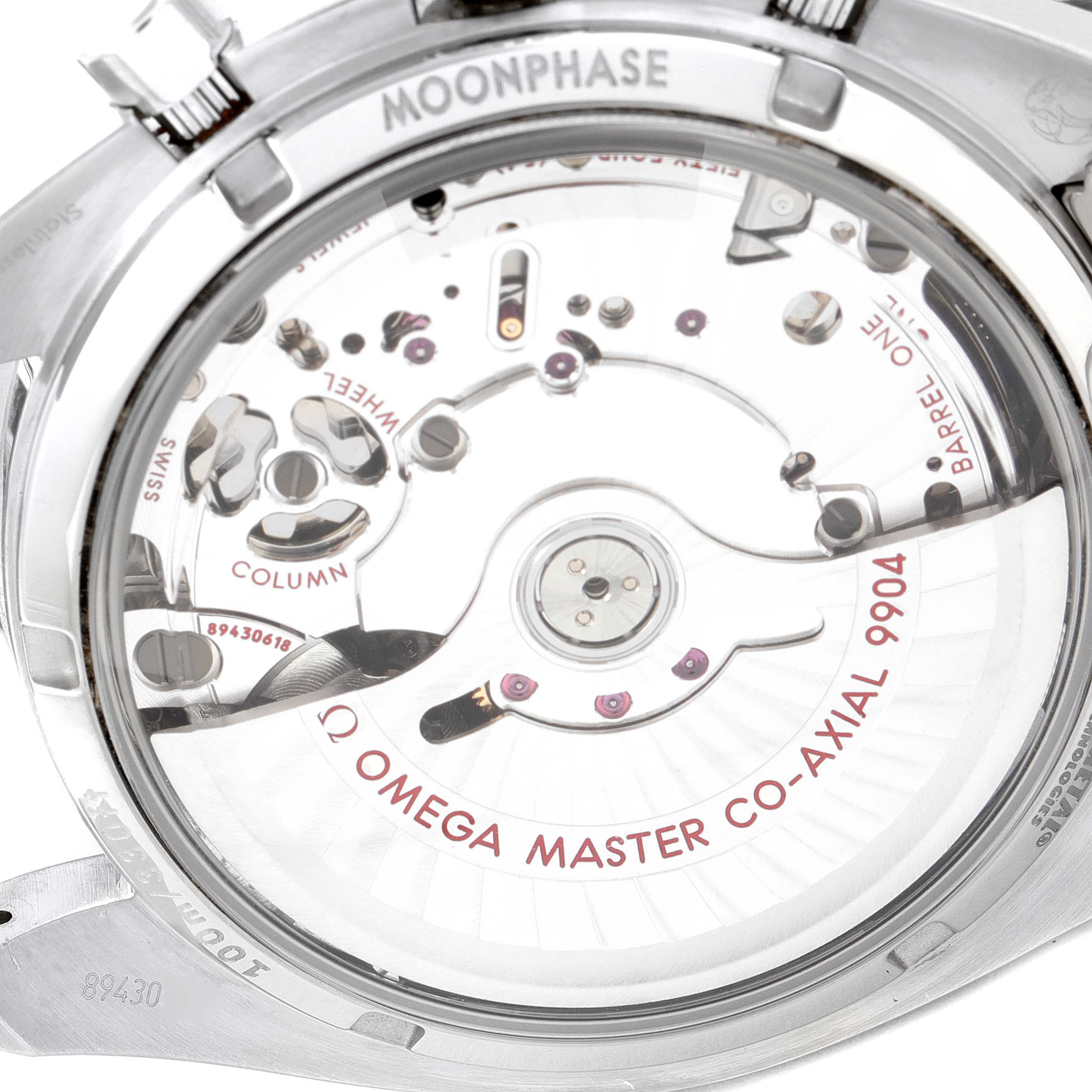 The image shows the back view of an Omega Speedmaster 304.30.44.52.01.001 Men
s Stainless Steel Black Dial 304.30.44.52.01.001 Men
s Stainless Steel Black Dial watch, revealing the movement and internal mechanisms.