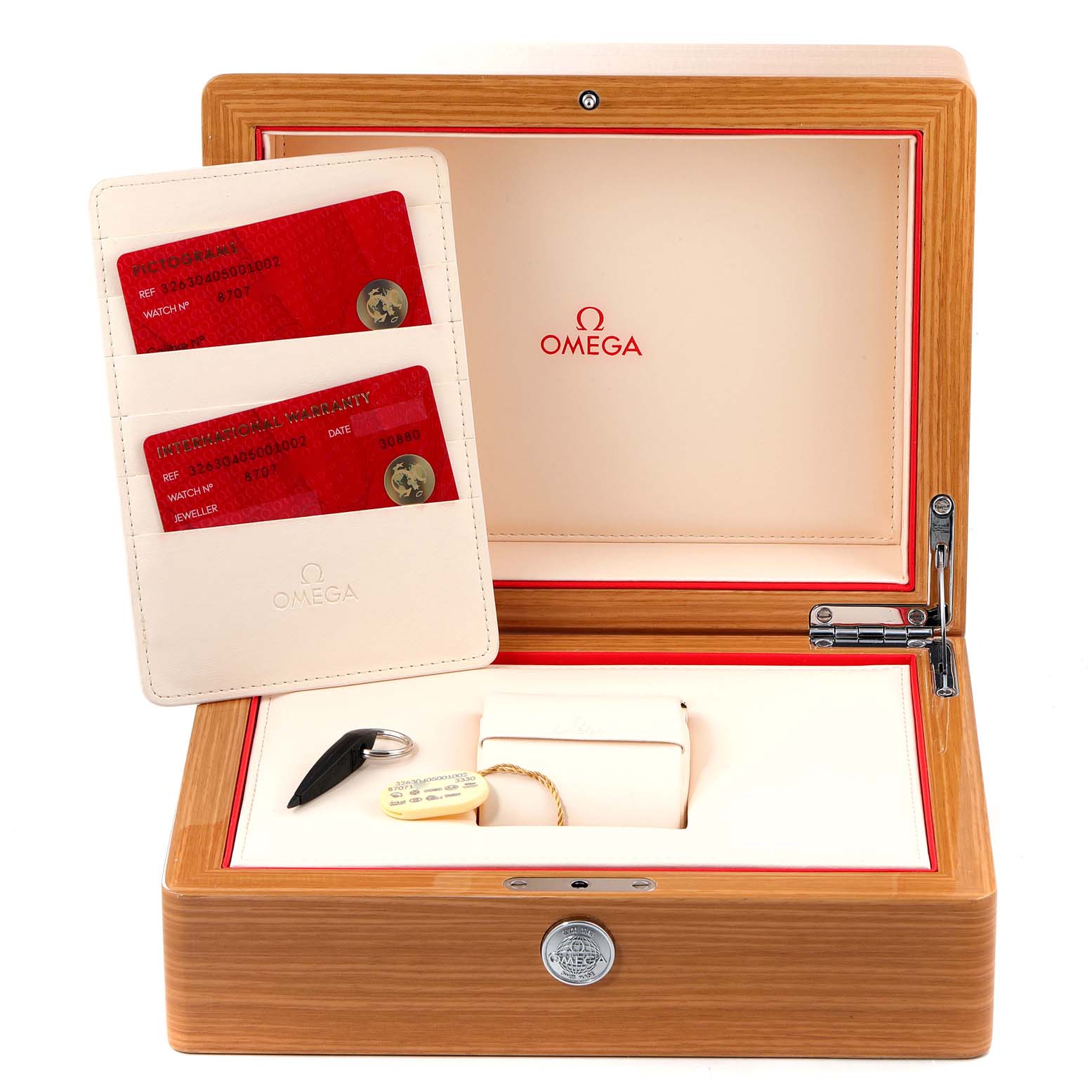 The image shows the open box of an Omega Speedmaster 326.30.40.50.01.002 Men
s Stainless Steel Black Dial 326.30.40.50.01.002 Men
s Stainless Steel Black Dial watch, featuring warranty cards and accessories like a tag and tool.