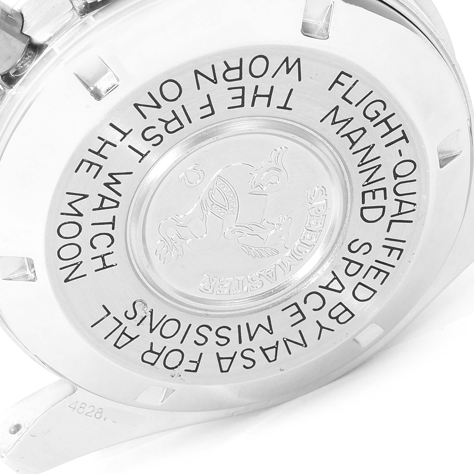 The image shows the back case of an Omega Speedmaster 145.022 Men's Stainless Steel Black Dial 145.022 Men's Stainless Steel Black Dial watch, highlighting its engraved text and emblem.