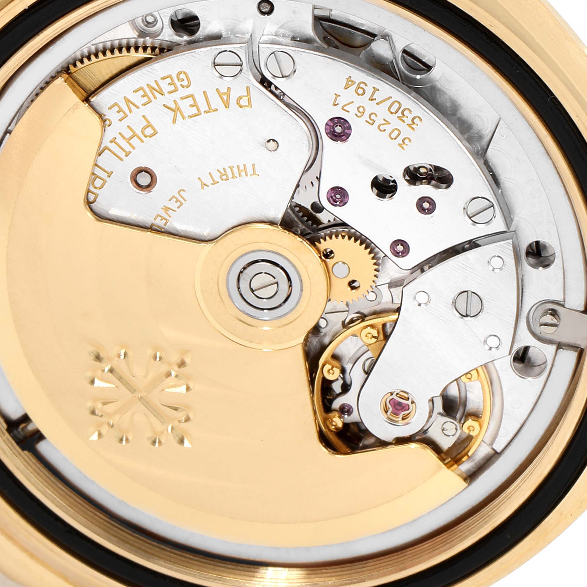 This image shows the intricate internal mechanical movement of a Patek Philippe Aquanaut 5060J Men's Yellow Gold Black Dial 5060J Men's Yellow Gold Black Dial watch from a backside angle.