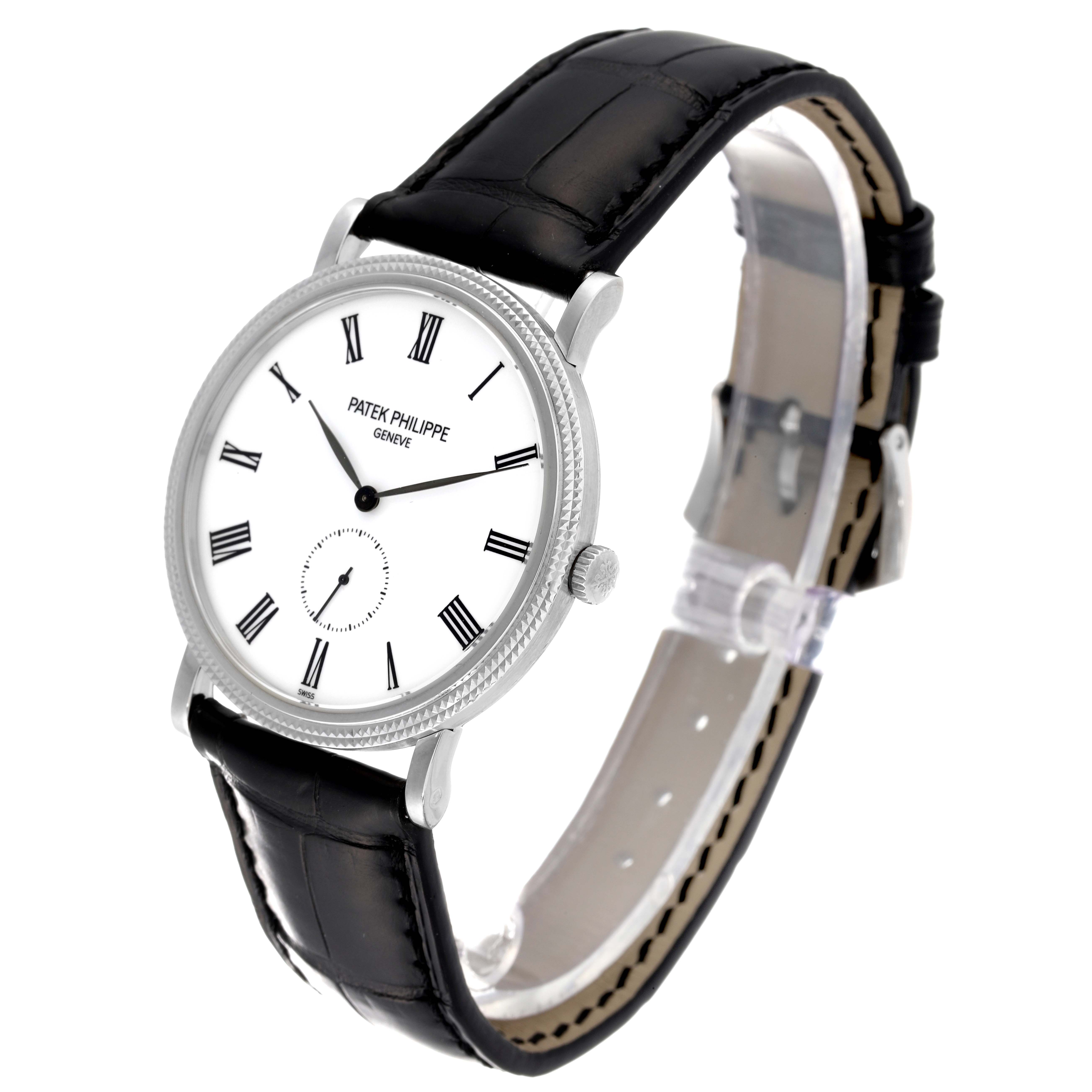 The image shows a Patek Philippe Calatrava 5119G Men
s White Gold White Dial 5119G Men
s White Gold White Dial watch at an angled view, highlighting the face, strap, and bezel.