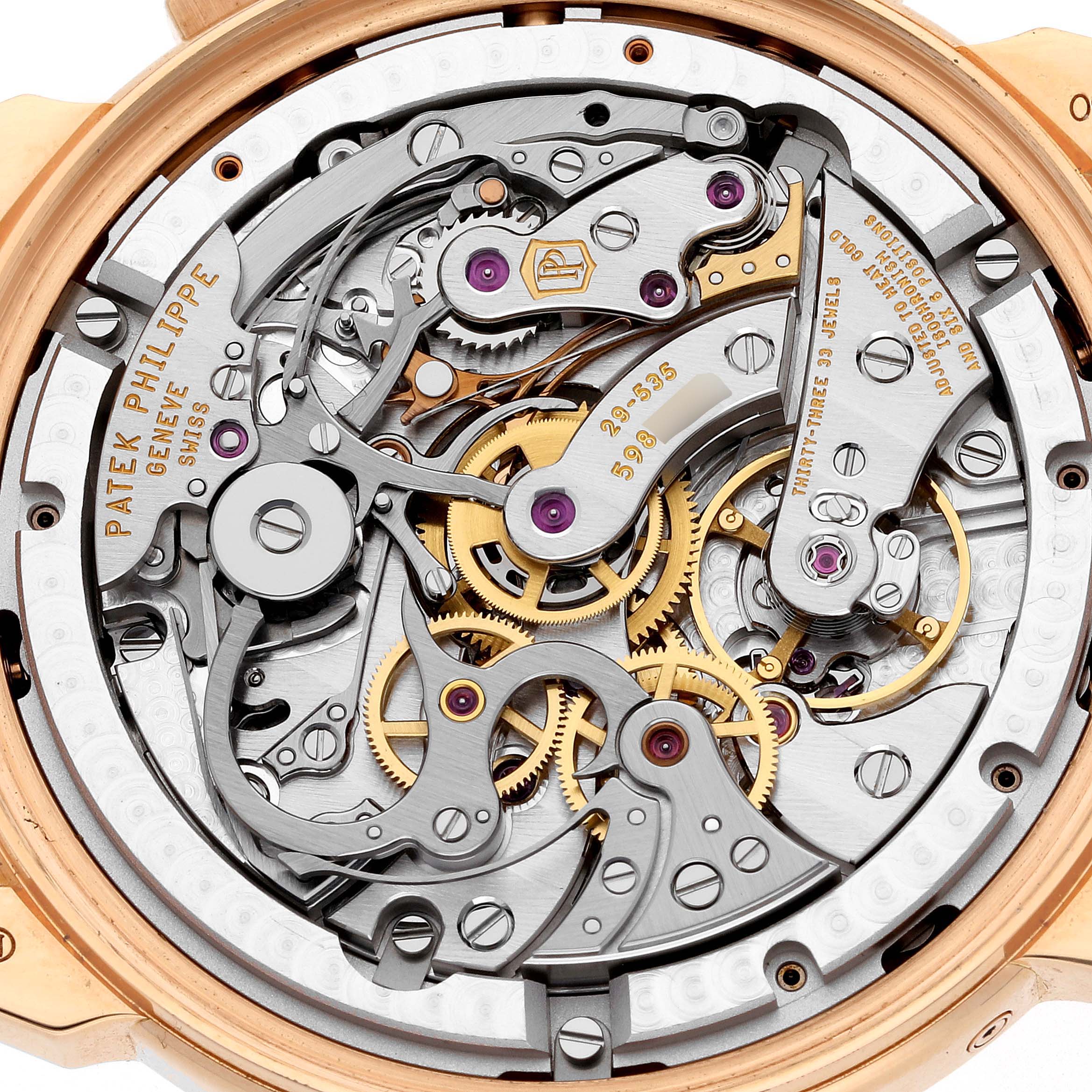 The image shows a close-up view of the intricate movement and inner workings of a Patek Philippe Complications 5270R Men's Rose Gold Silver Dial 5270R Men's Rose Gold Silver Dial watch.