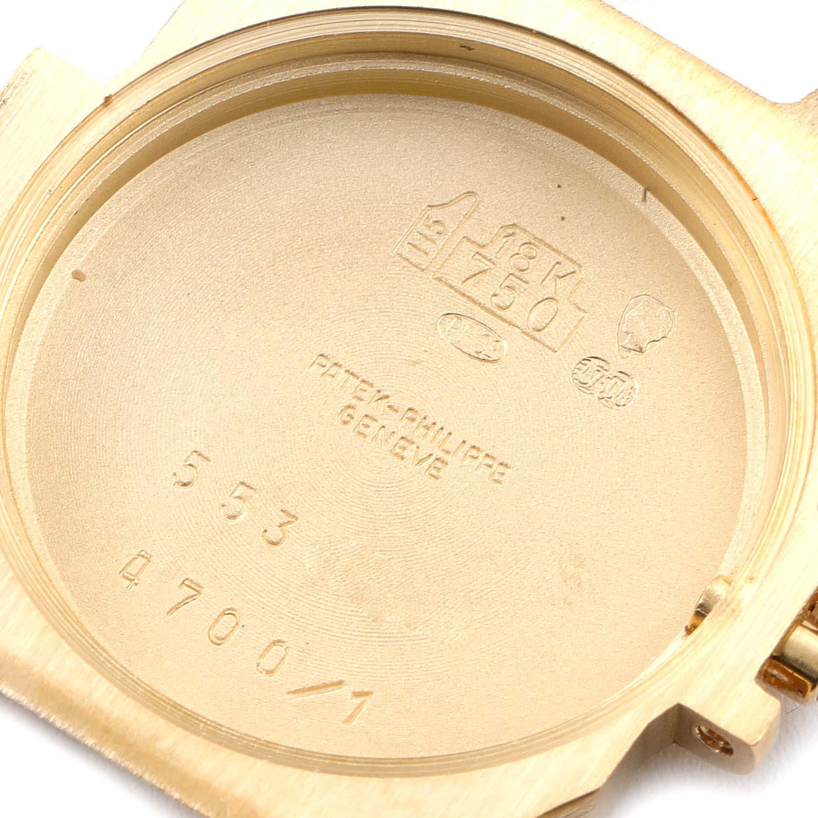 The image shows the inner case back of a Patek Philippe Nautilus 4700/1 Women's Yellow Gold Champagne Dial 4700/1 Women's Yellow Gold Champagne Dial watch with engravings and hallmarks visible.