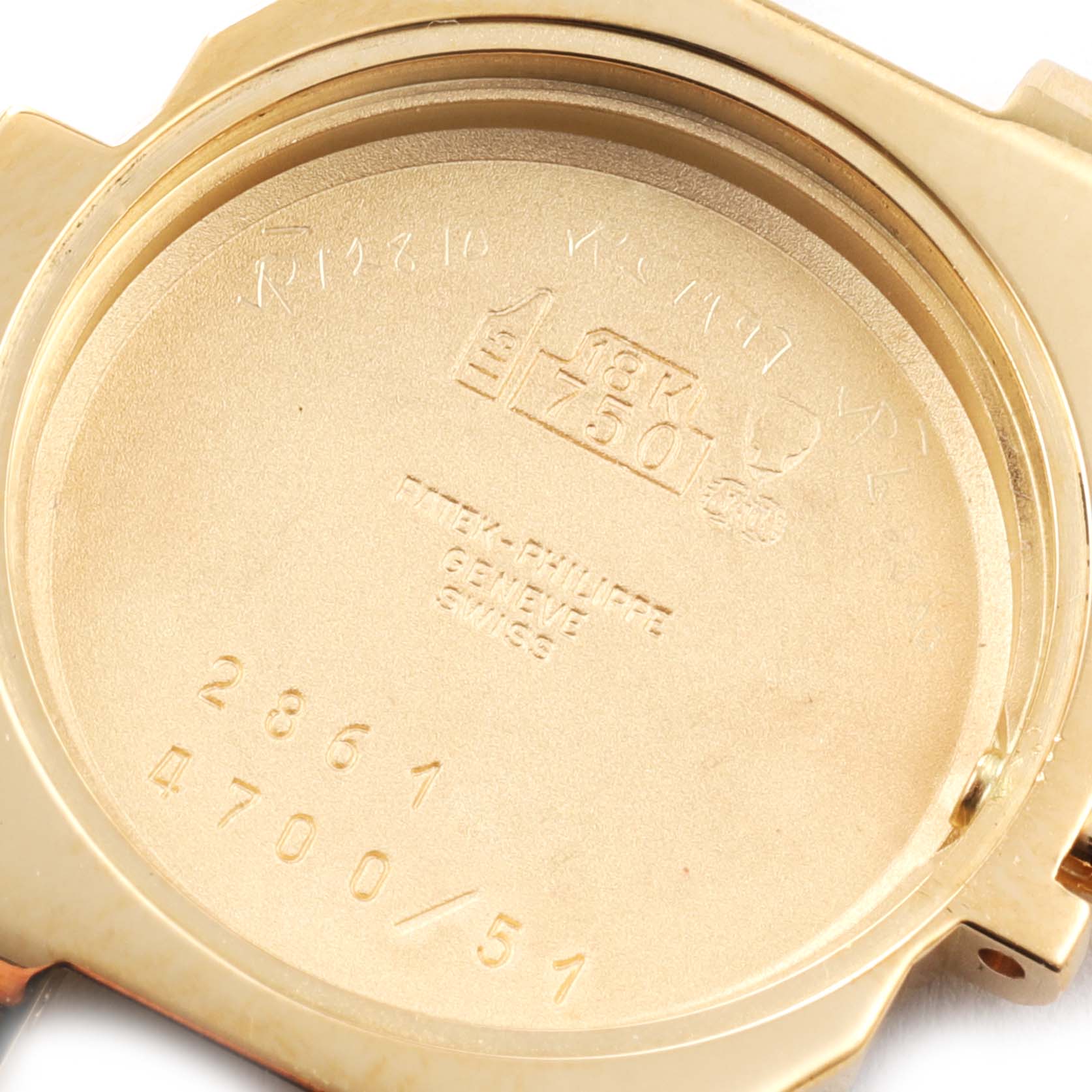 The image shows the back case of a Patek Philippe Nautilus 4700/1 Women's Yellow Gold Beige Dial 4700/1 Women's Yellow Gold Beige Dial watch, highlighting the interior markings and inscriptions.