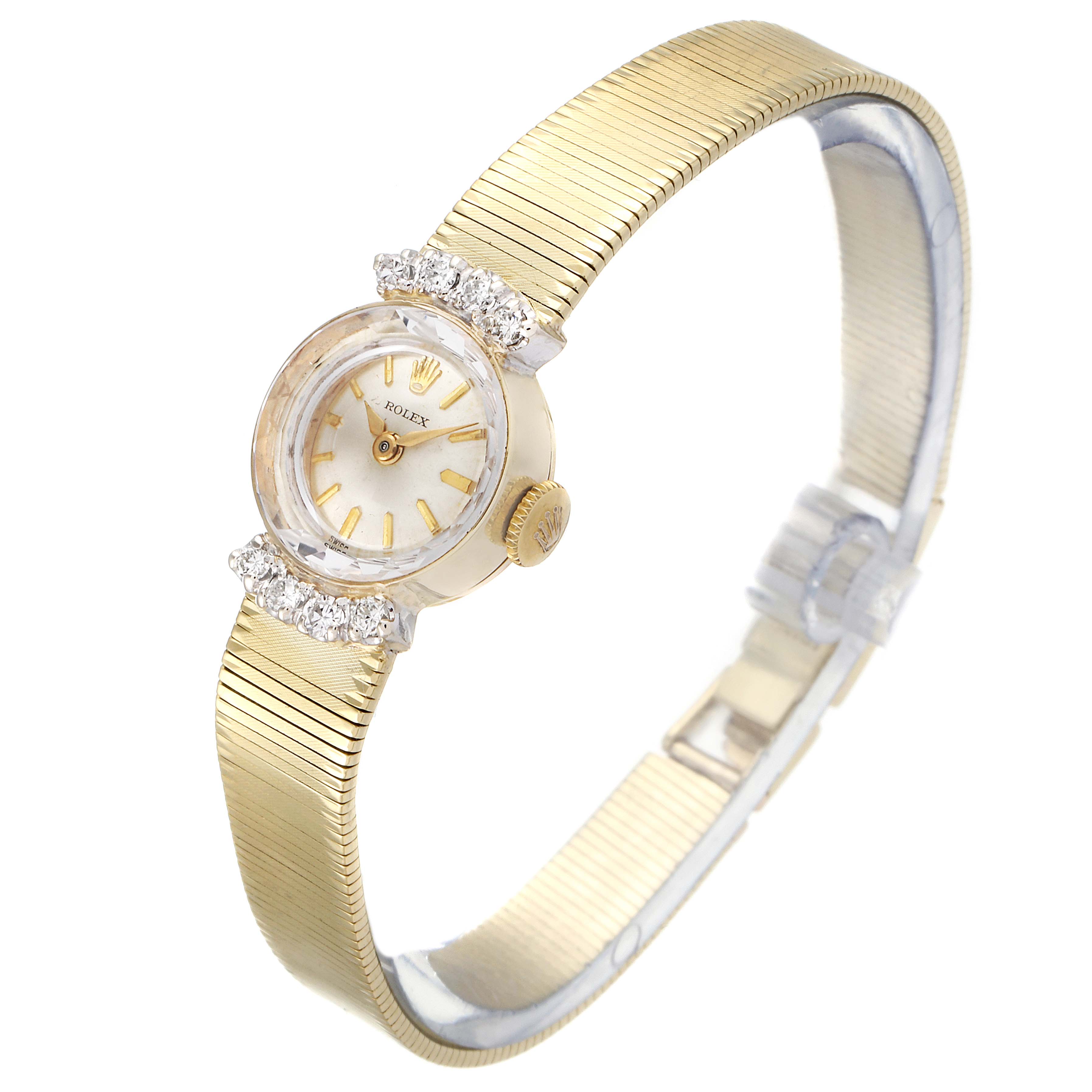 The image features a Rolex Cocktail  Women's Yellow Gold Silver Dial  Women's Yellow Gold Silver Dial model watch, showing a top-angle view of the face, crown, and band.