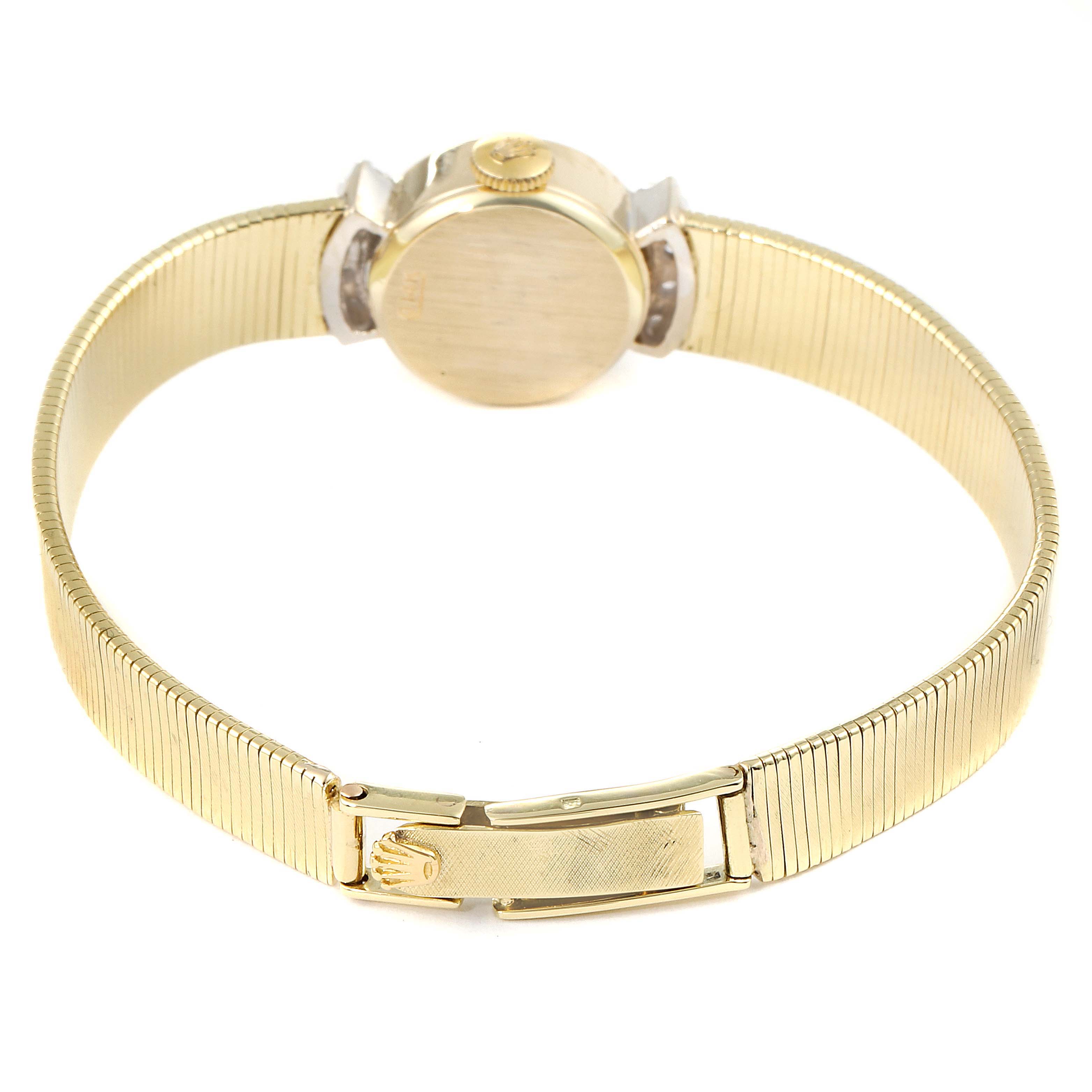 This image shows the back view of the Rolex Cocktail  Women's Yellow Gold Silver Dial  Women's Yellow Gold Silver Dial model watch, displaying the clasp, case back, and part of the bracelet.