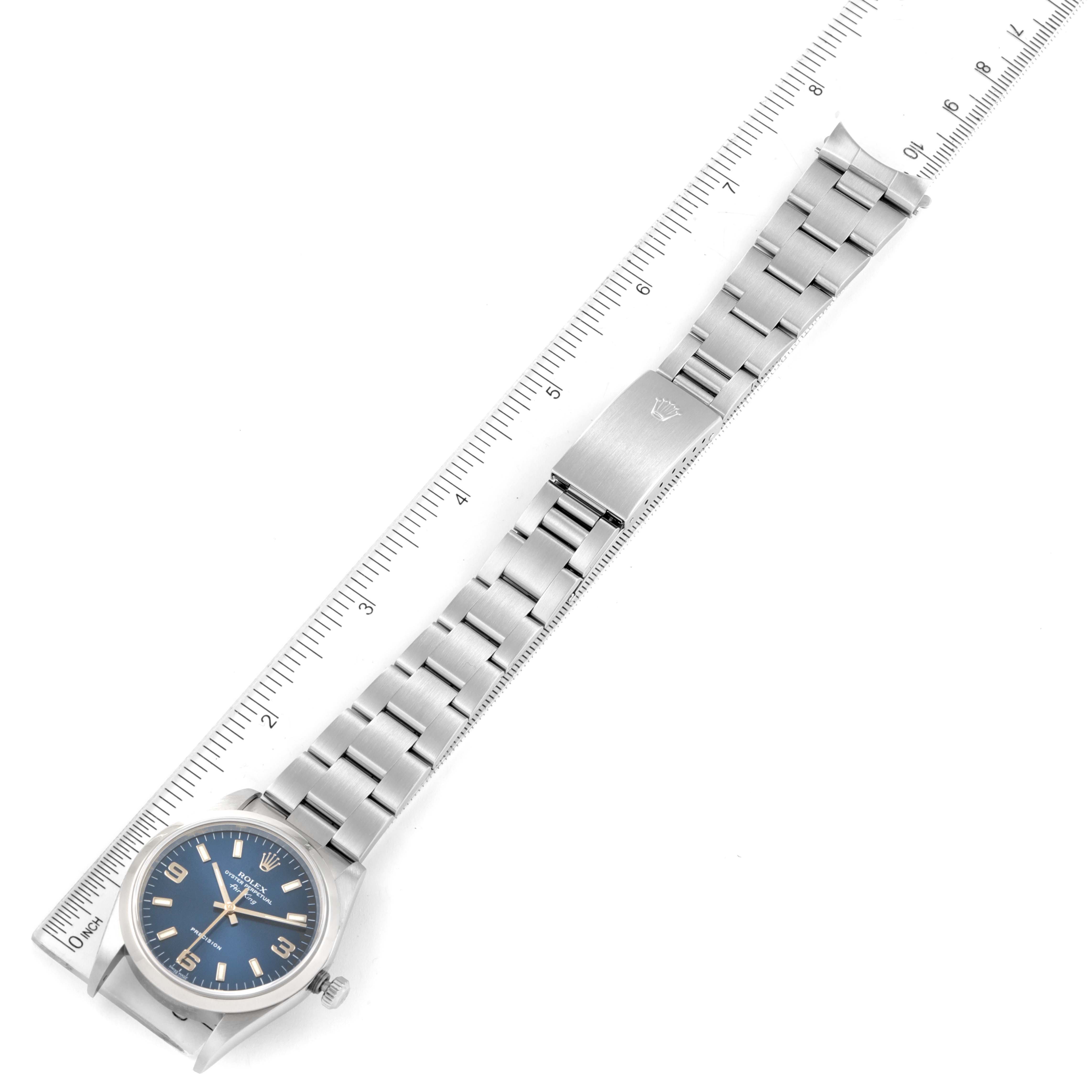 This image shows a Rolex Air-King 14000 Men's Stainless Steel Blue Dial 14000 Men's Stainless Steel Blue Dial watch laid flat, displaying the face, bracelet, and clasp next to a measuring ruler.