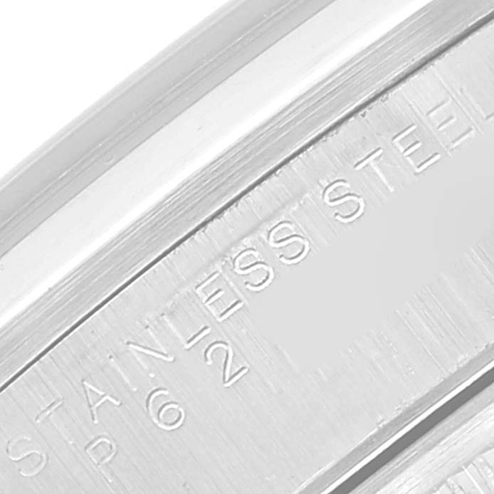 This close-up image of the Rolex Datejust 15200 Men's Stainless Steel Blue Dial 15200 Men's Stainless Steel Blue Dial shows a portion of the case with "STAINLESS STEEL" engraved.