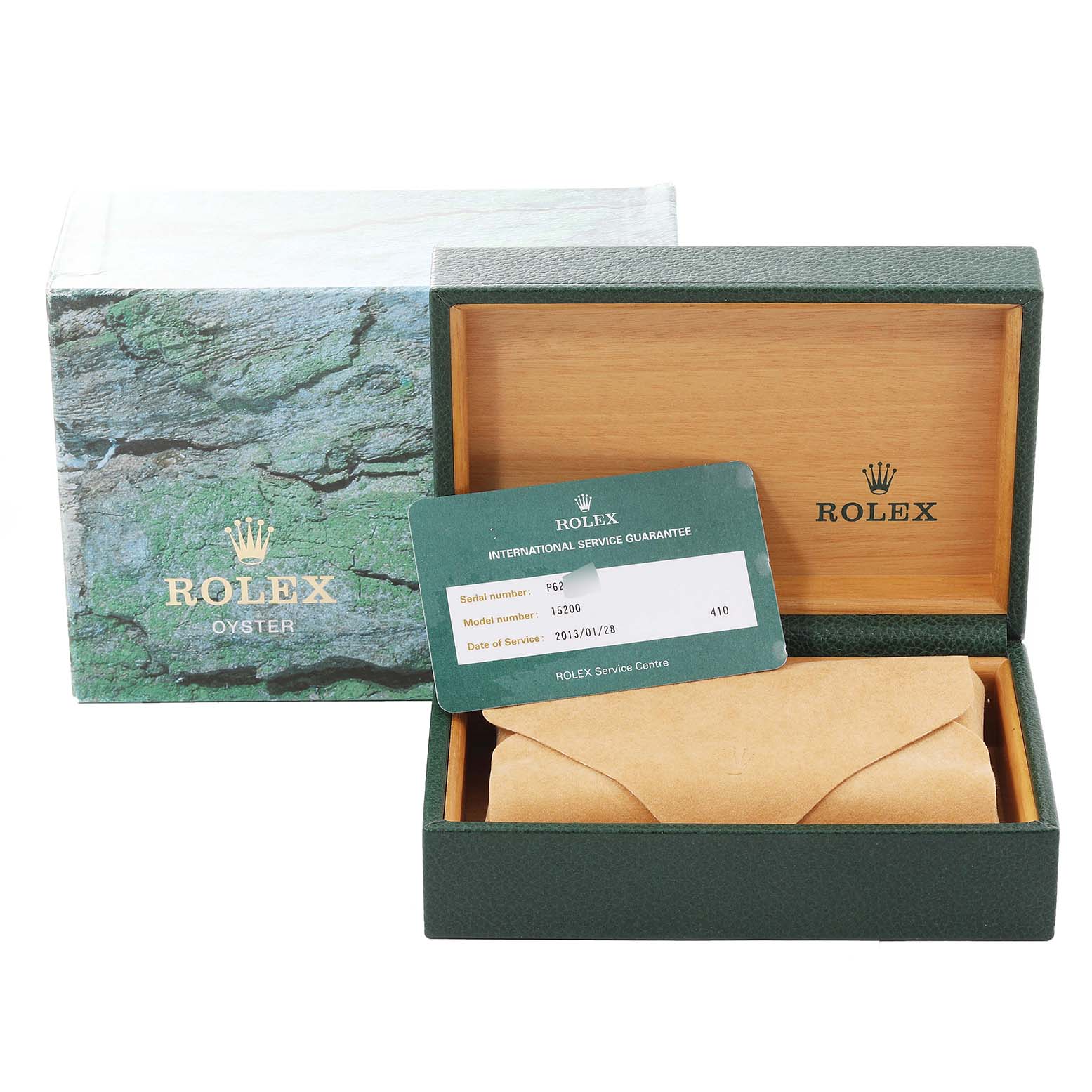 The image shows the packaging, a guarantee card, and a partly wrapped Rolex Datejust 15200 Men's Stainless Steel Blue Dial 15200 Men's Stainless Steel Blue Dial watch in an open green and wooden box.