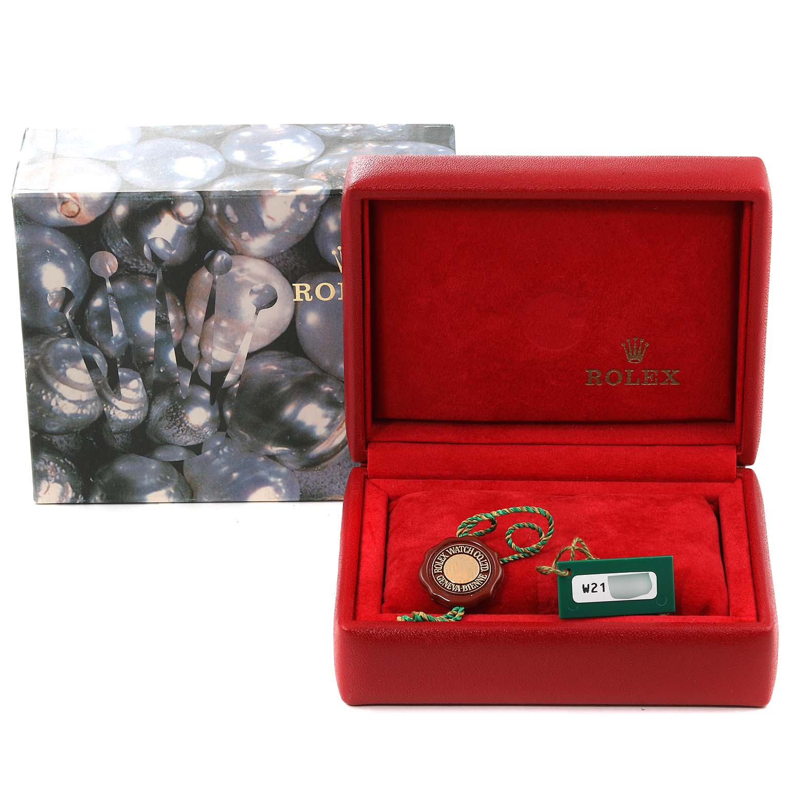 The image shows a Rolex Datejust 69173 Women
s Steel and Gold (two tone) Champagne Dial 69173 Women
s Steel and Gold (two tone) Champagne Dial watch box and accessories, including a red case and tags, viewed from the front.