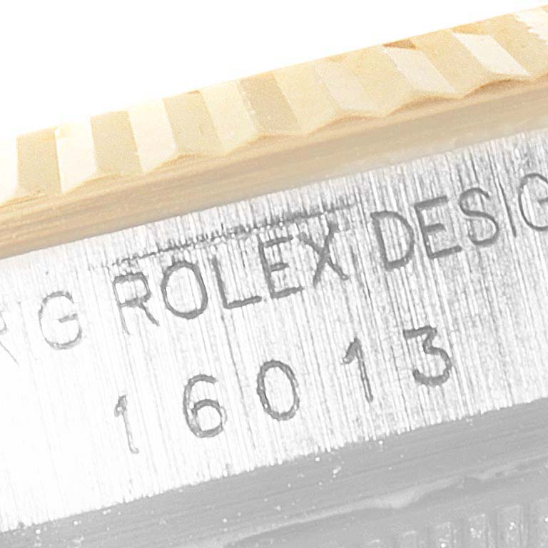 This image shows a close-up of the side engraving and fluted bezel of the Rolex Vintage Collection 16013 Men's Steel and Gold (two tone) Silver Dial 16013 Men's Steel and Gold (two tone) Silver Dial model 16013.