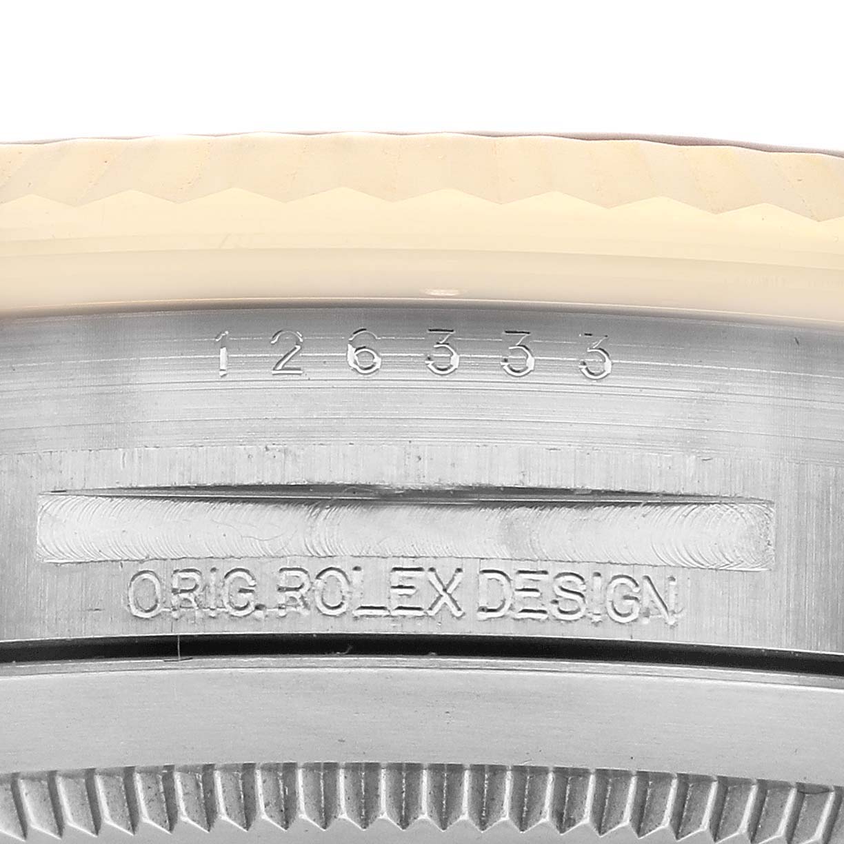 The image shows a close-up of the side of the Rolex Datejust 41 126333 Men's Steel and Gold (two tone) Black Dial 126333 Men's Steel and Gold (two tone) Black Dial model, highlighting the engraved model number and the phrase "ORIG ROLEX DESIGN."
