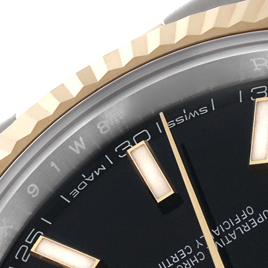 This image shows a close-up of the dial and fluted bezel of the Rolex Datejust 41 126333 Men's Steel and Gold (two tone) Black Dial 126333 Men's Steel and Gold (two tone) Black Dial watch.