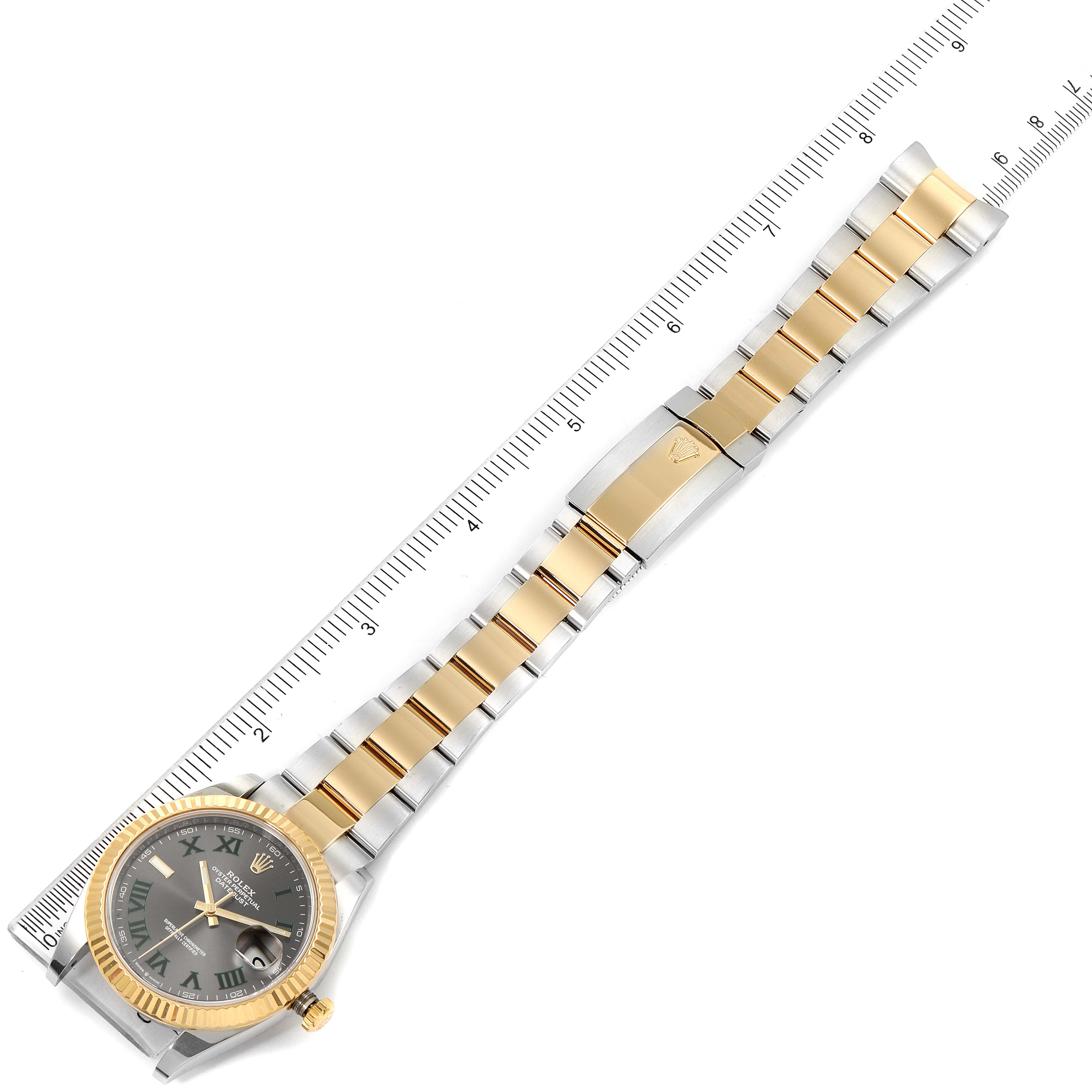 The Rolex Datejust 41 126333 Men's Steel and Gold (two tone) Grey Dial 126333 Men's Steel and Gold (two tone) Grey Dial model watch is shown flat and fully extended with its face and bracelet visible, alongside a ruler for scale.