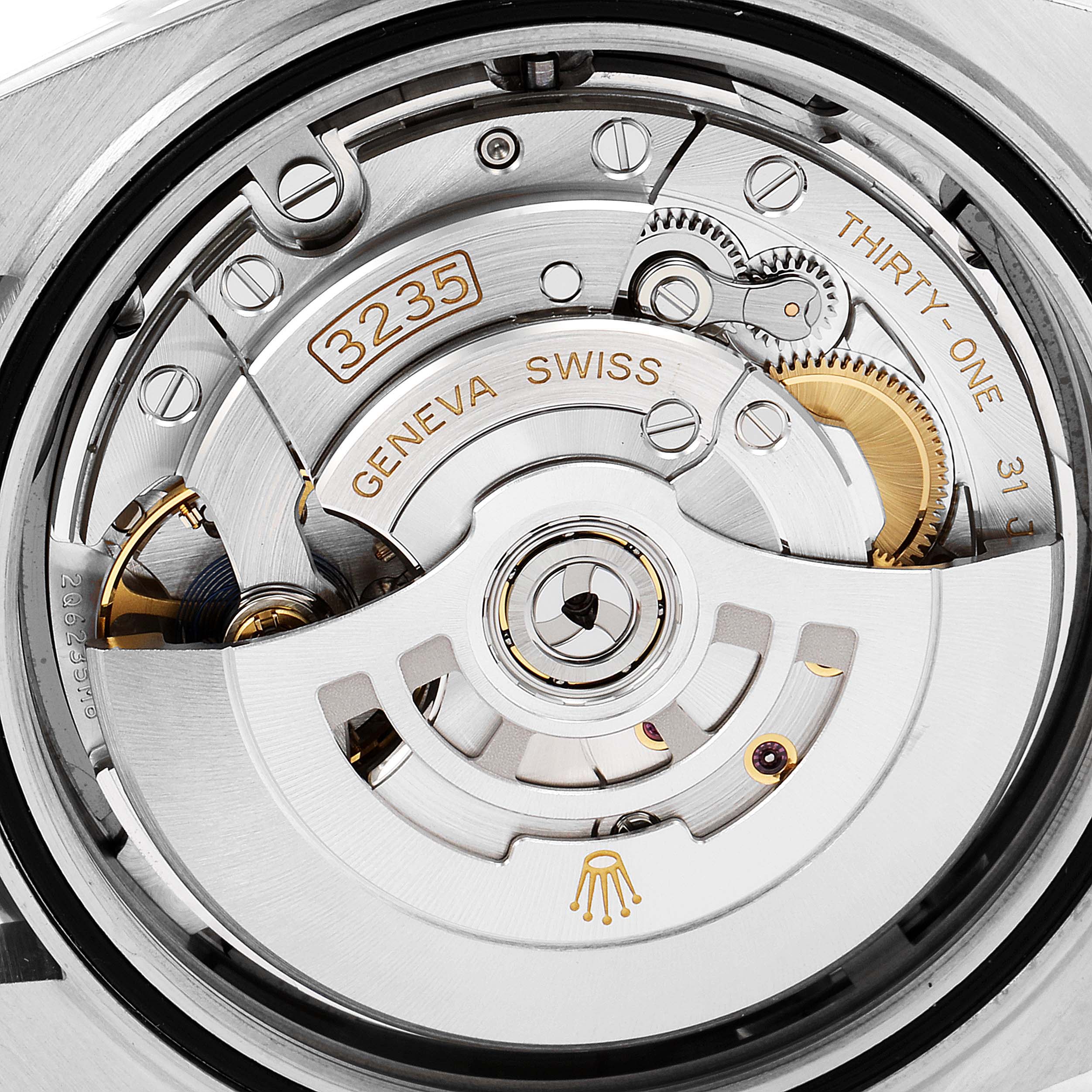 This image shows the intricate internal mechanism of the Rolex Datejust 41 126333 Men's Steel and Gold (two tone) Grey Dial 126333 Men's Steel and Gold (two tone) Grey Dial watch from a close-up rear angle.