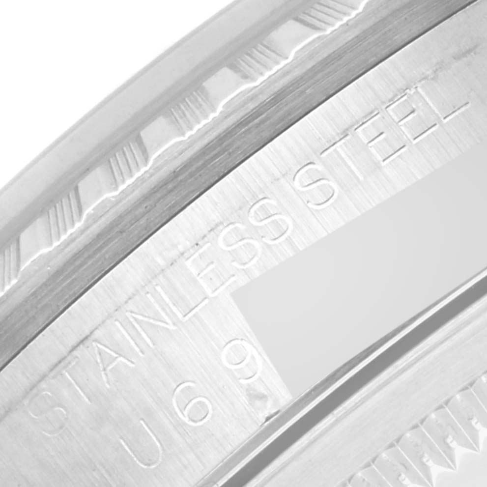 This image shows a close-up of the case back engraving on a Rolex Datejust 16220 Men's Stainless Steel Blue Dial 16220 Men's Stainless Steel Blue Dial watch, highlighting the words "STAINLESS STEEL".