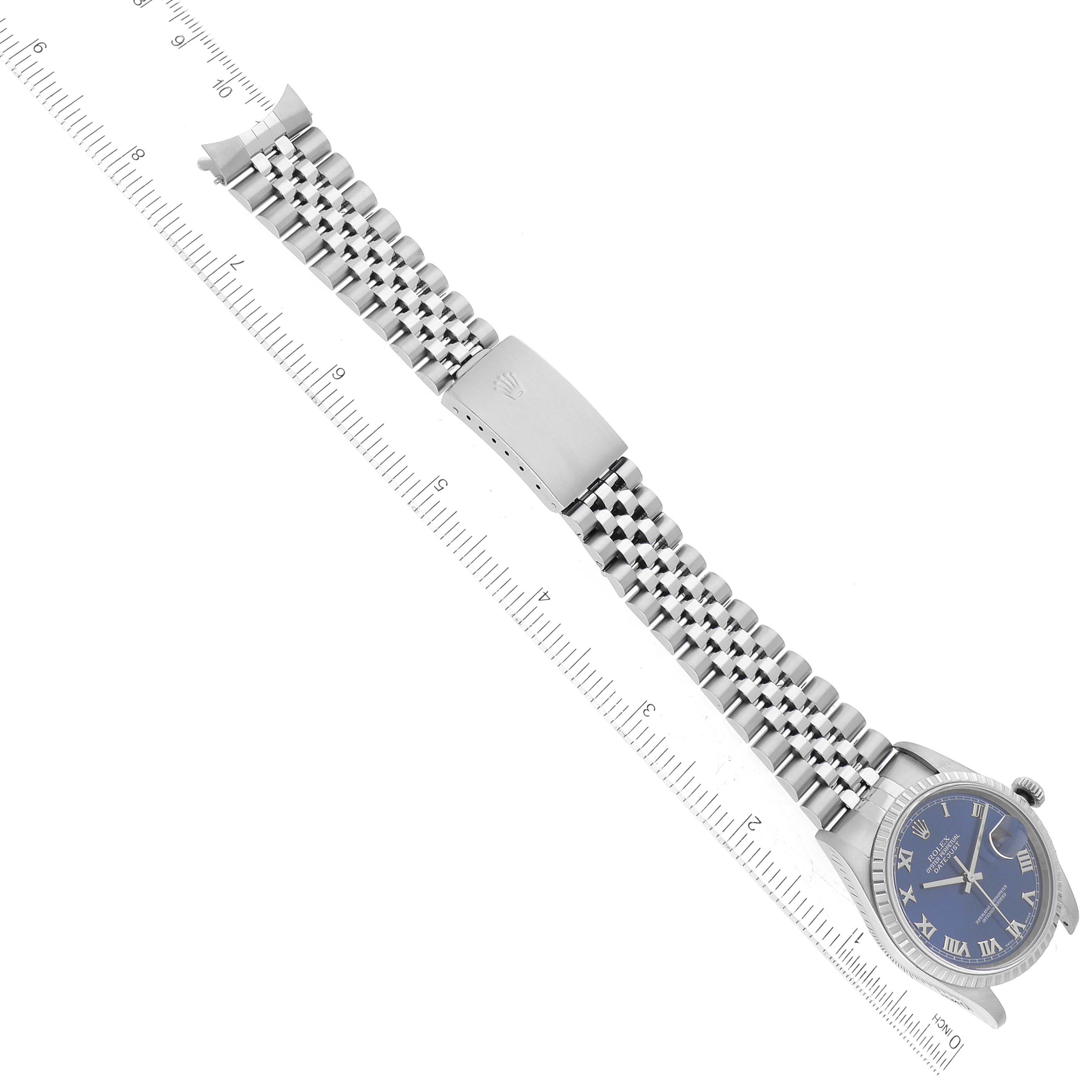 The Rolex Datejust 16220 Men's Stainless Steel Blue Dial 16220 Men's Stainless Steel Blue Dial watch is shown in a flat, diagonal angle, highlighting its face, bracelet, and clasp.