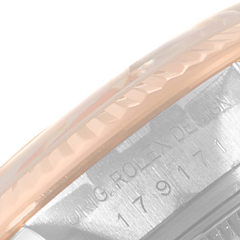 The image shows a close-up of the side of a Rolex Datejust 179171 Women's Steel and Gold (two tone) Pink Dial 179171 Women's Steel and Gold (two tone) Pink Dial watch, highlighting the bezel and model engraving.